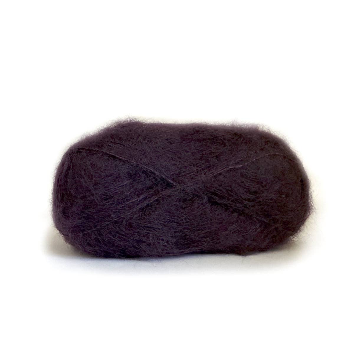 Kelbourne Woolens Harmony yarn in a rich purple hue, perfect for soft and cozy knitting projects.