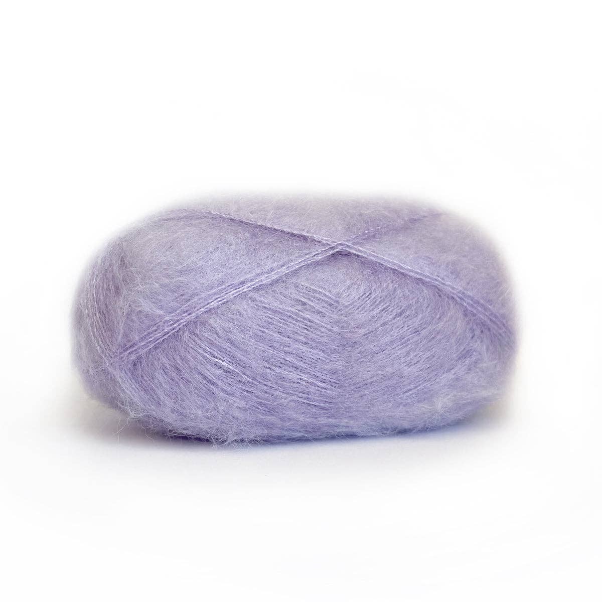 Soft lavender Kelbourne Woolens Harmony yarn in a fluffy ball for knitting and crafting projects