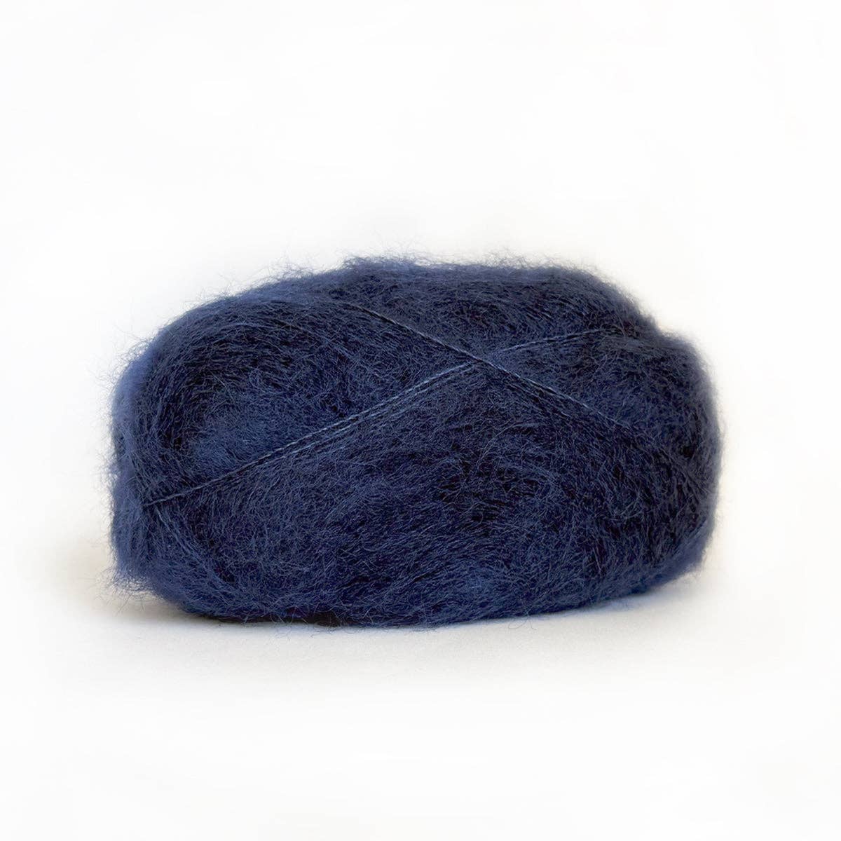 Kelbourne Woolens Harmony yarn in deep navy color, perfect for knitting and crocheting projects