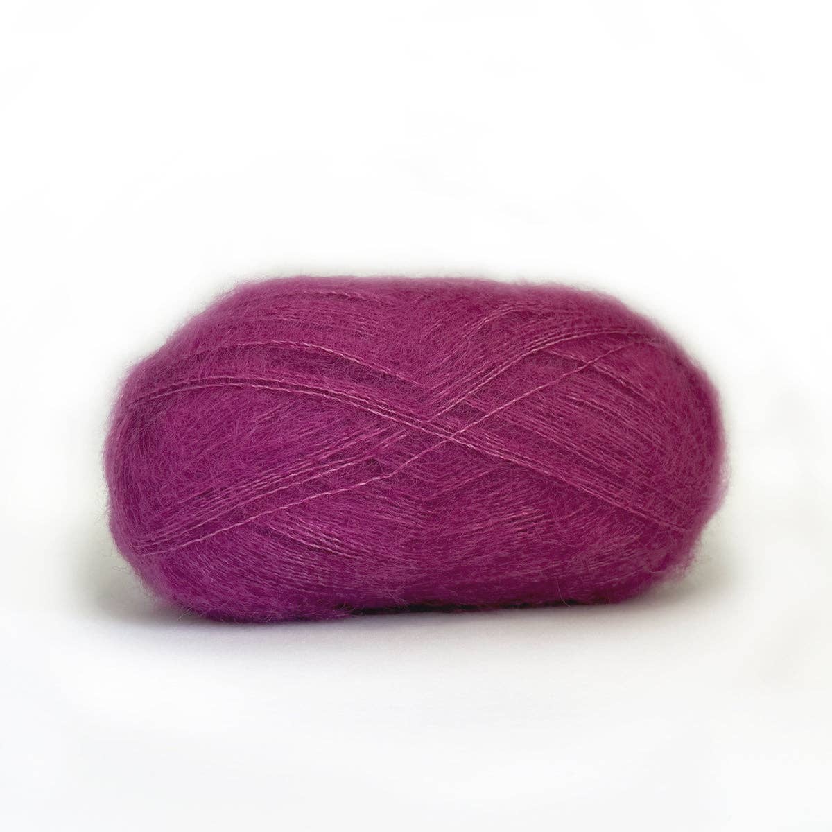 Kelbourne Woolens Harmony yarn in rich purple, perfect for knitting and crocheting soft projects