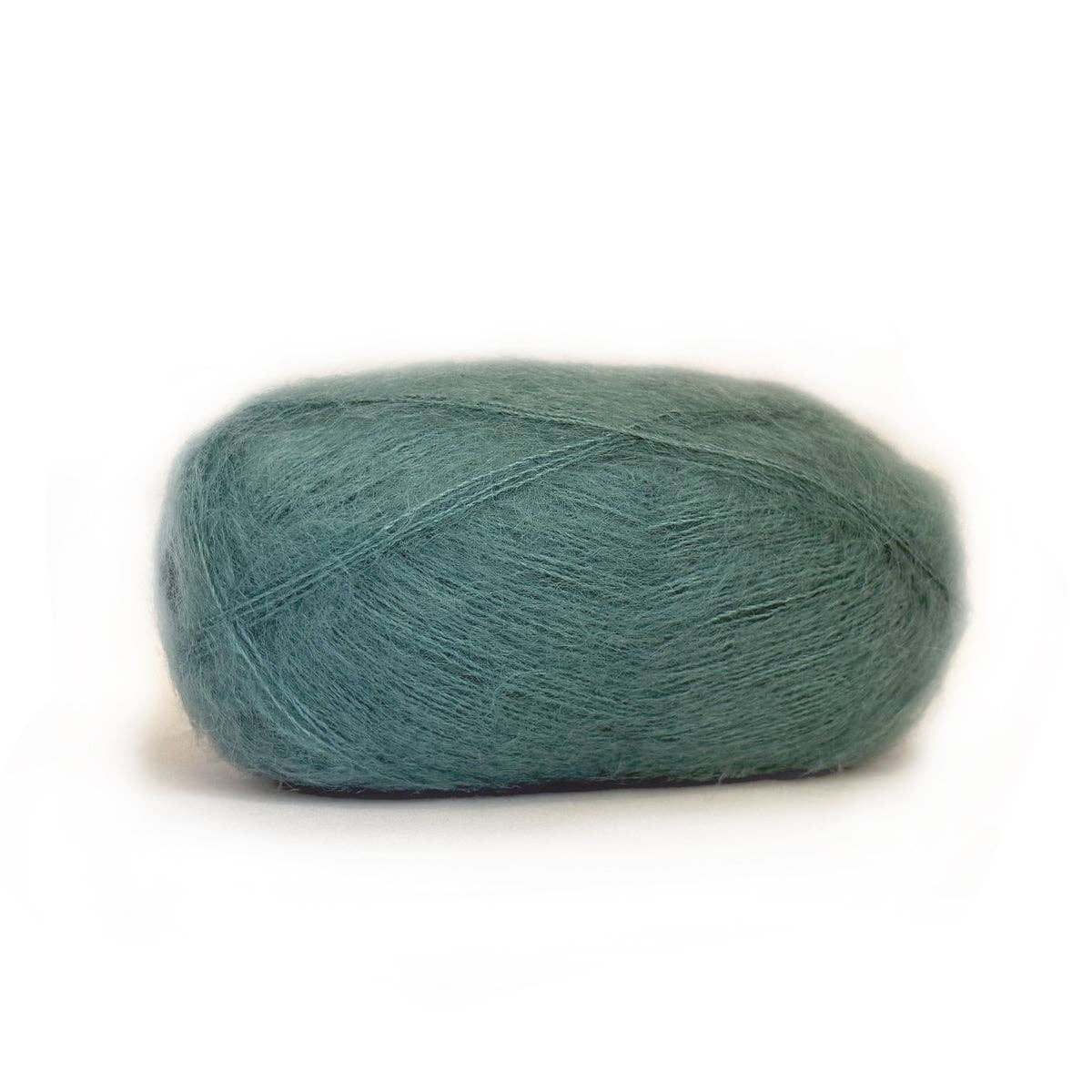 Kelbourne Woolens Harmony yarn in soft teal color, perfect for knitting and crochet projects