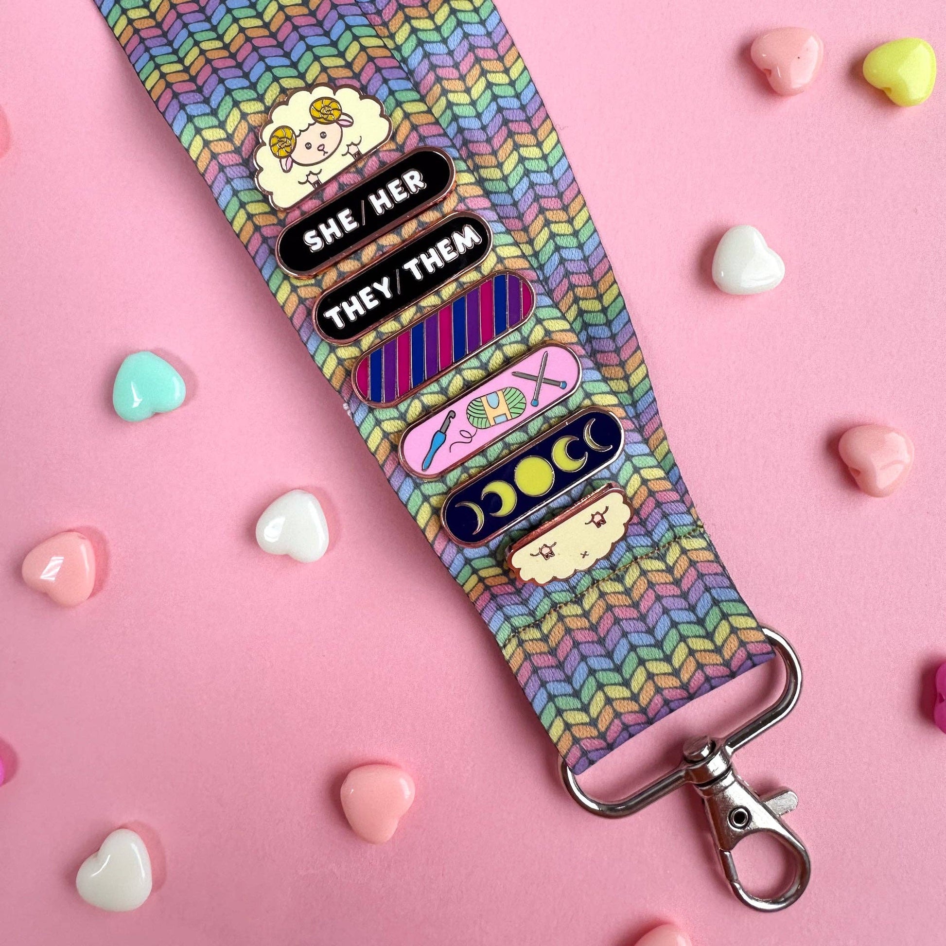 Colorful Hello Kitty lanyard with pride pins and clips for keys and ID badges