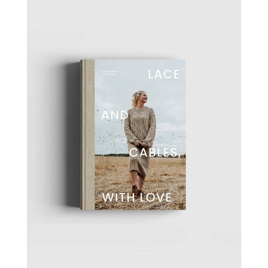 Lace and Cables, With Love knitting book featuring a model wearing a cozy knitting cable sweater