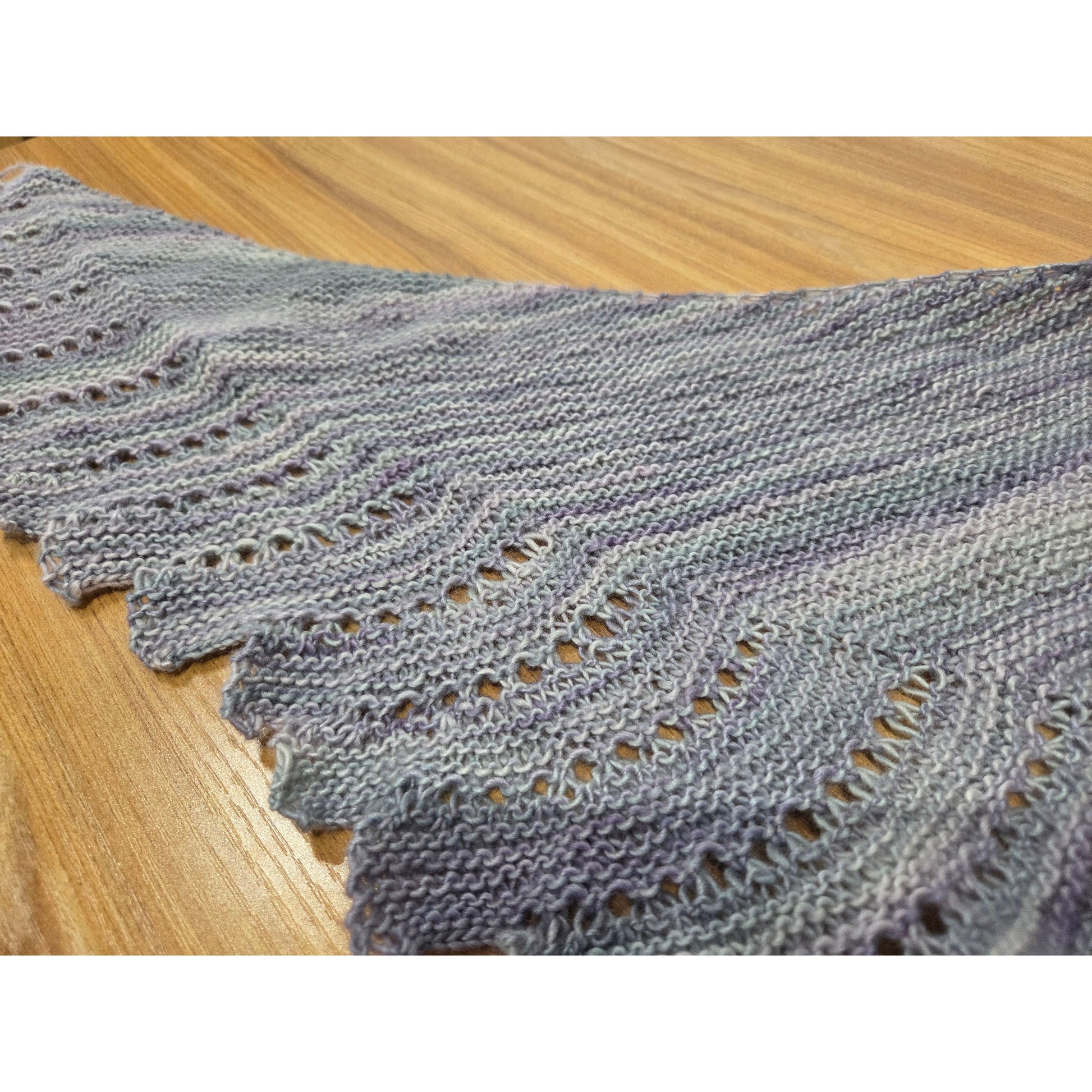 Handmade shawl featuring delicate lace patterns, perfect for showcasing knitting knits craftsmanship