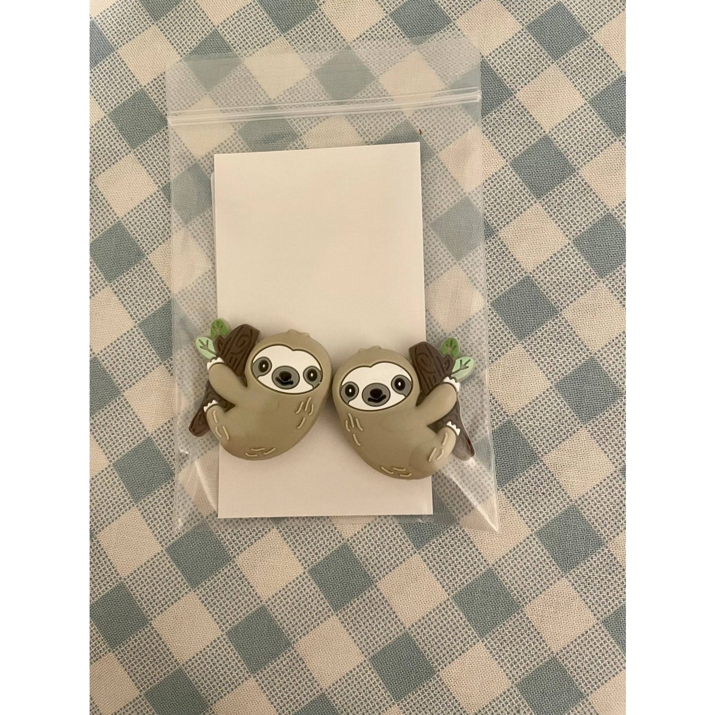 Cute sloth-themed knitting needle protectors by Comma Craft Co for knitting enthusiasts
