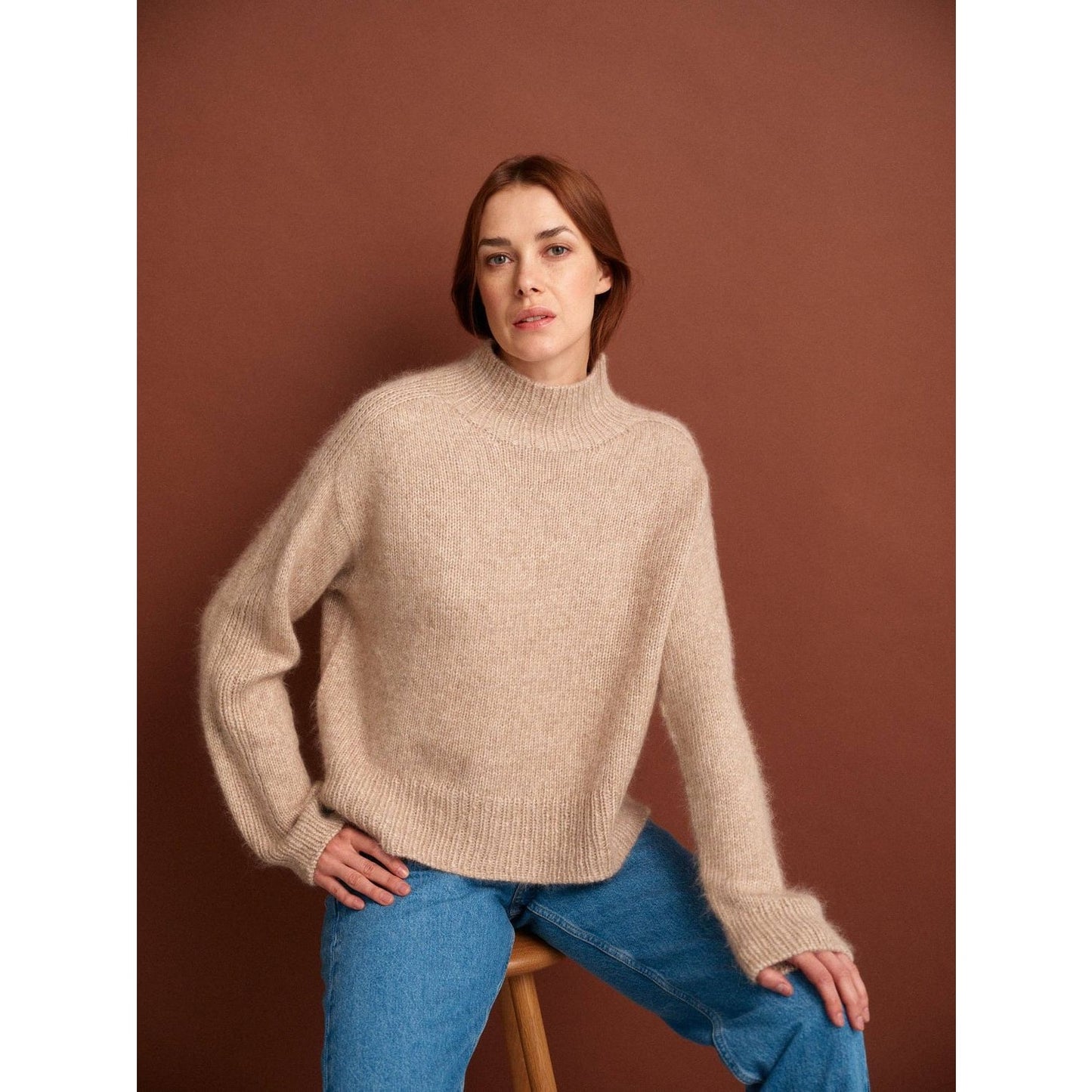 Cozy beige knitted sweater for women showcasing elegant patterns in knitting