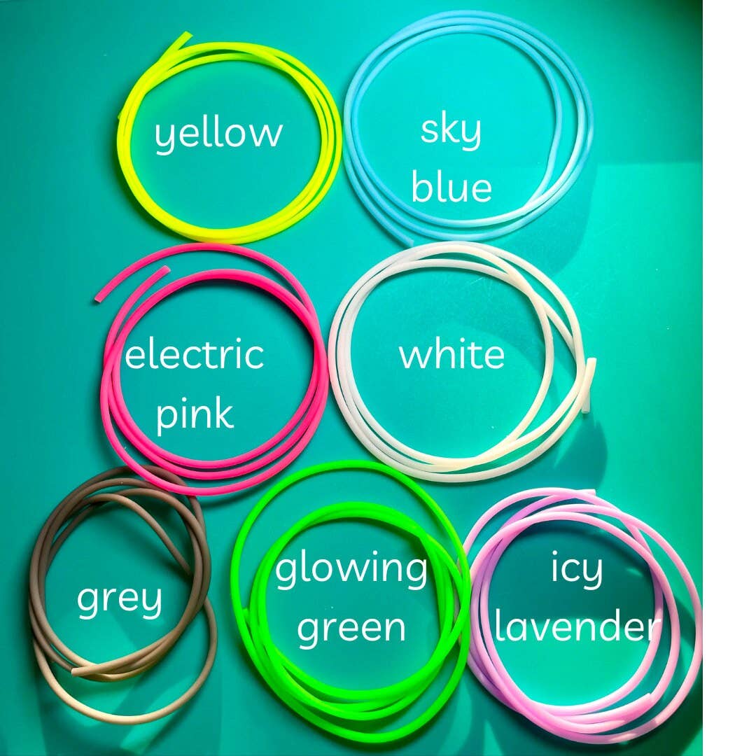 Colorful selection of knitting tools in various shades including yellow, sky blue, electric pink, and more