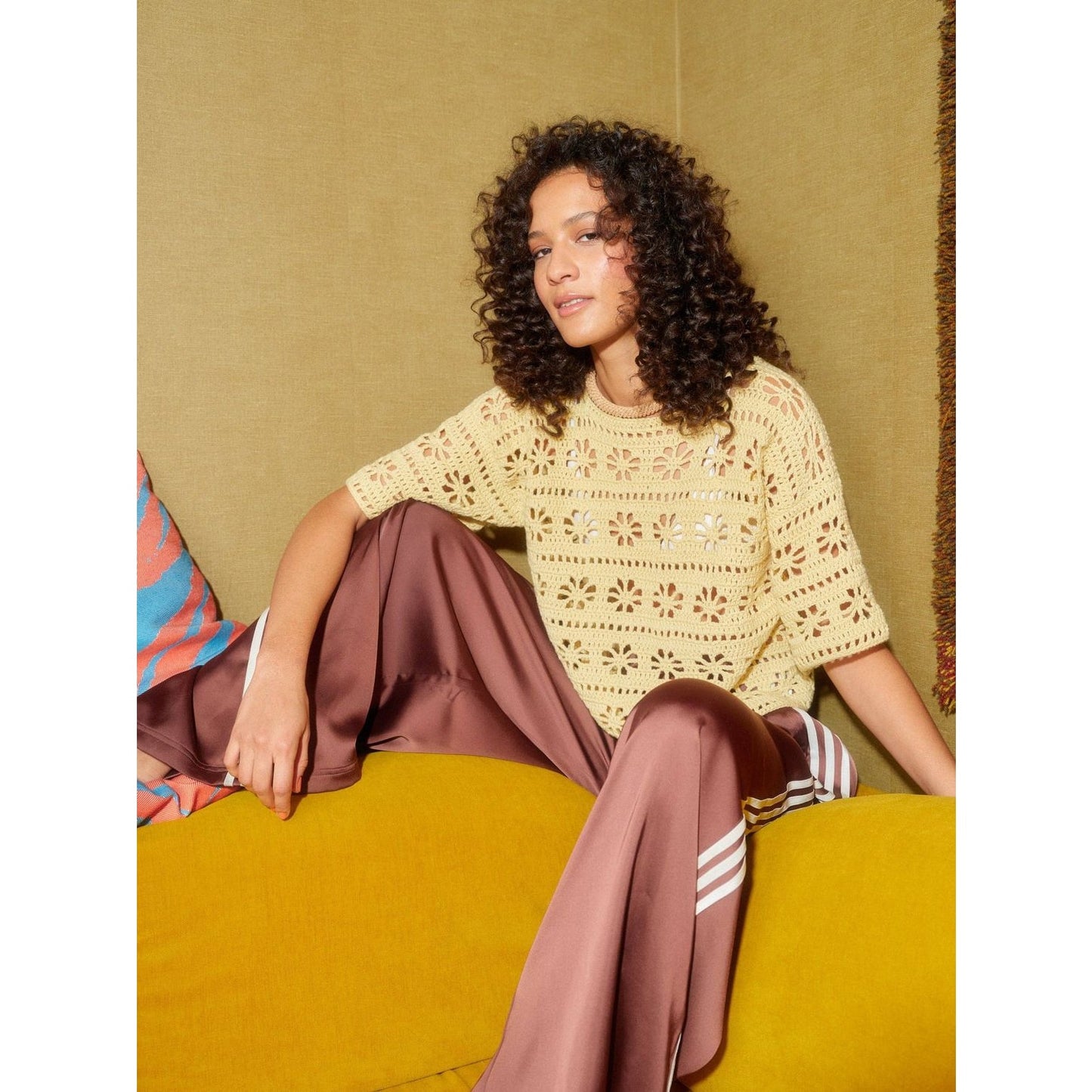 Crochet sweater with floral patterns, perfect for layering, showcasing its crochet with patterns design