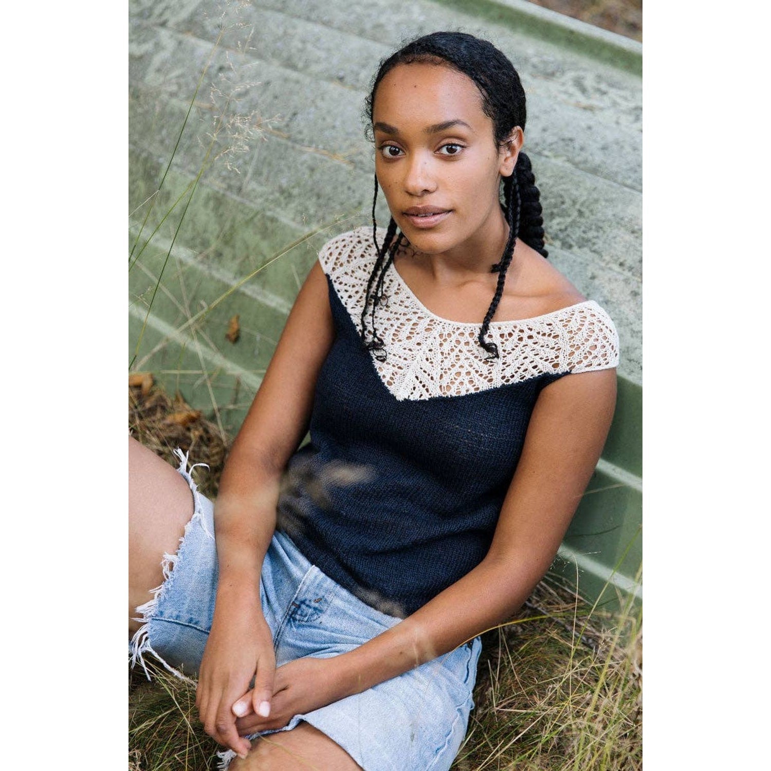 Laine Magazine Issue 25 featuring a woman in a stylish lace and knit top outdoors