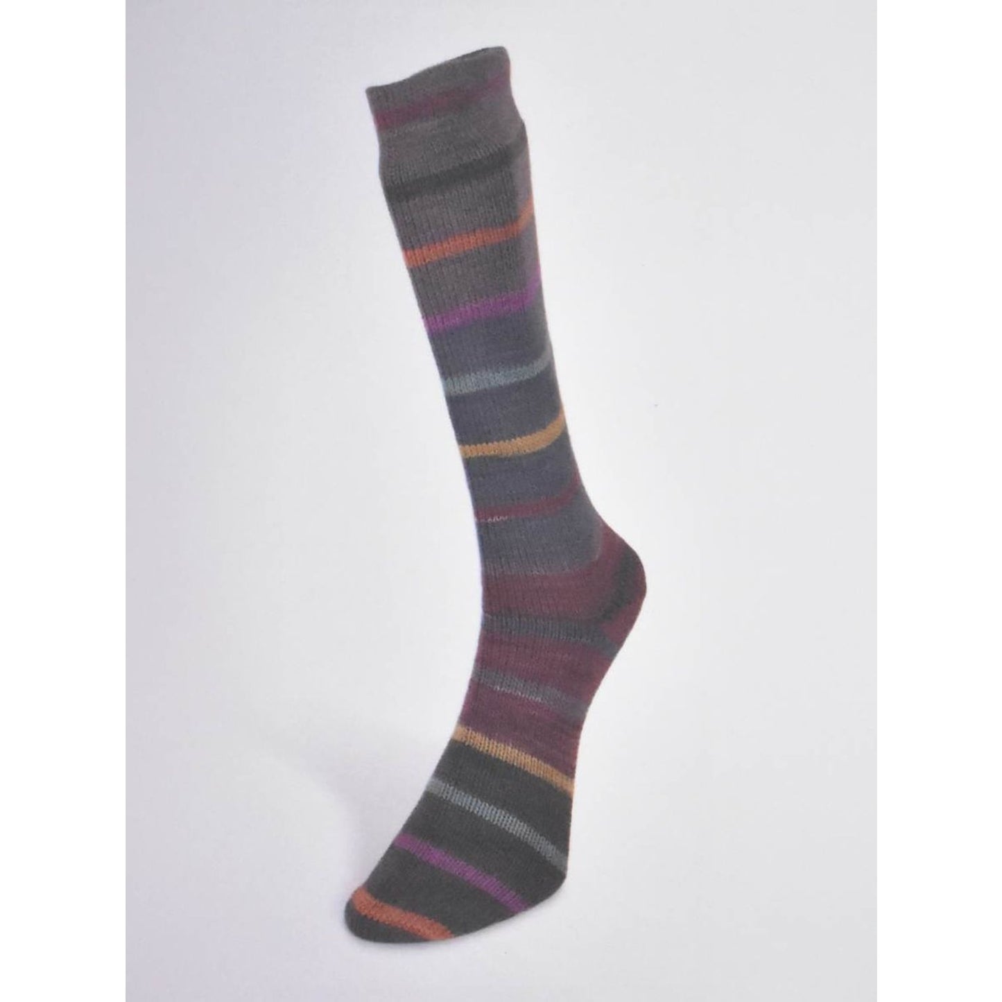 Laines du Nord Indulgence sock yarn knitted sock in shades of gray, purple, and orange stripes