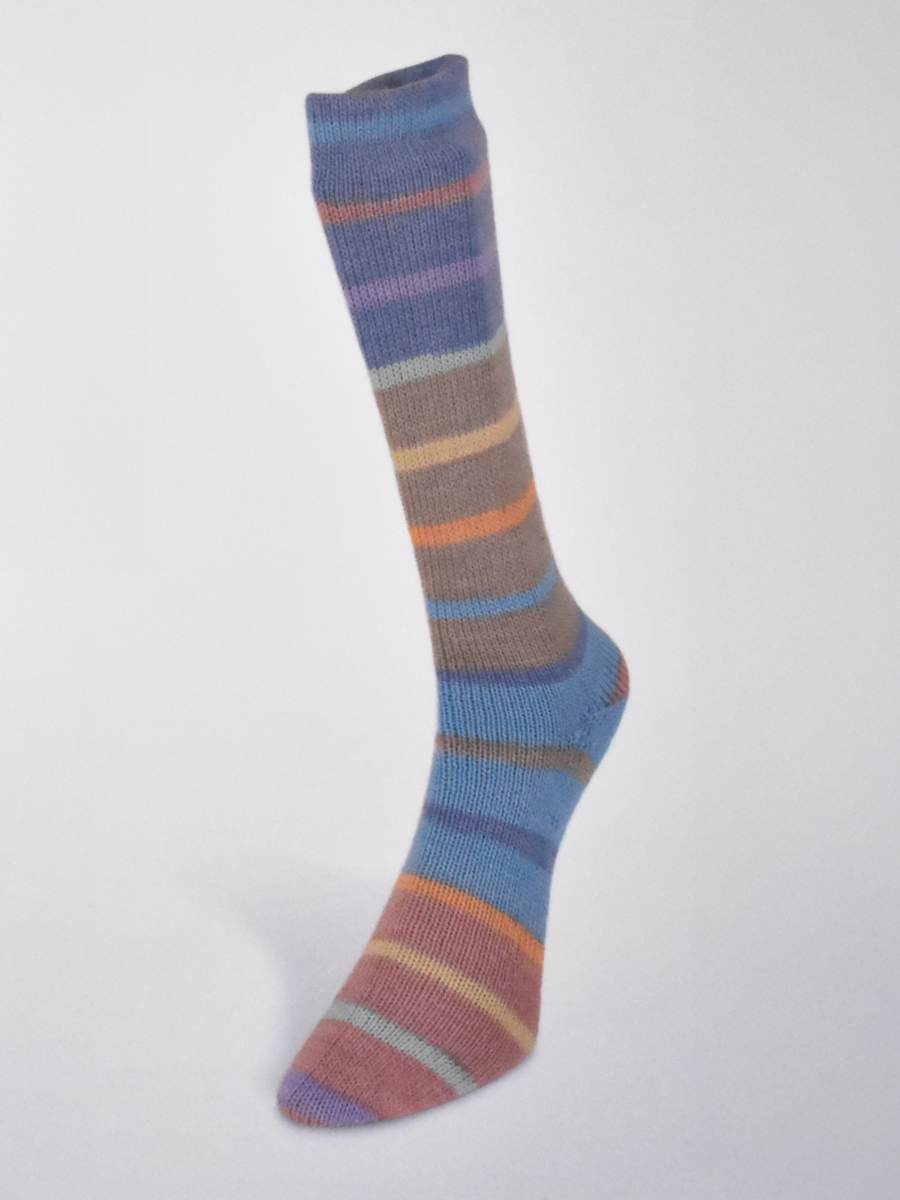 Striped sock featuring Laines du Nord Indulgence sock yarn in various colors for cozy footwear