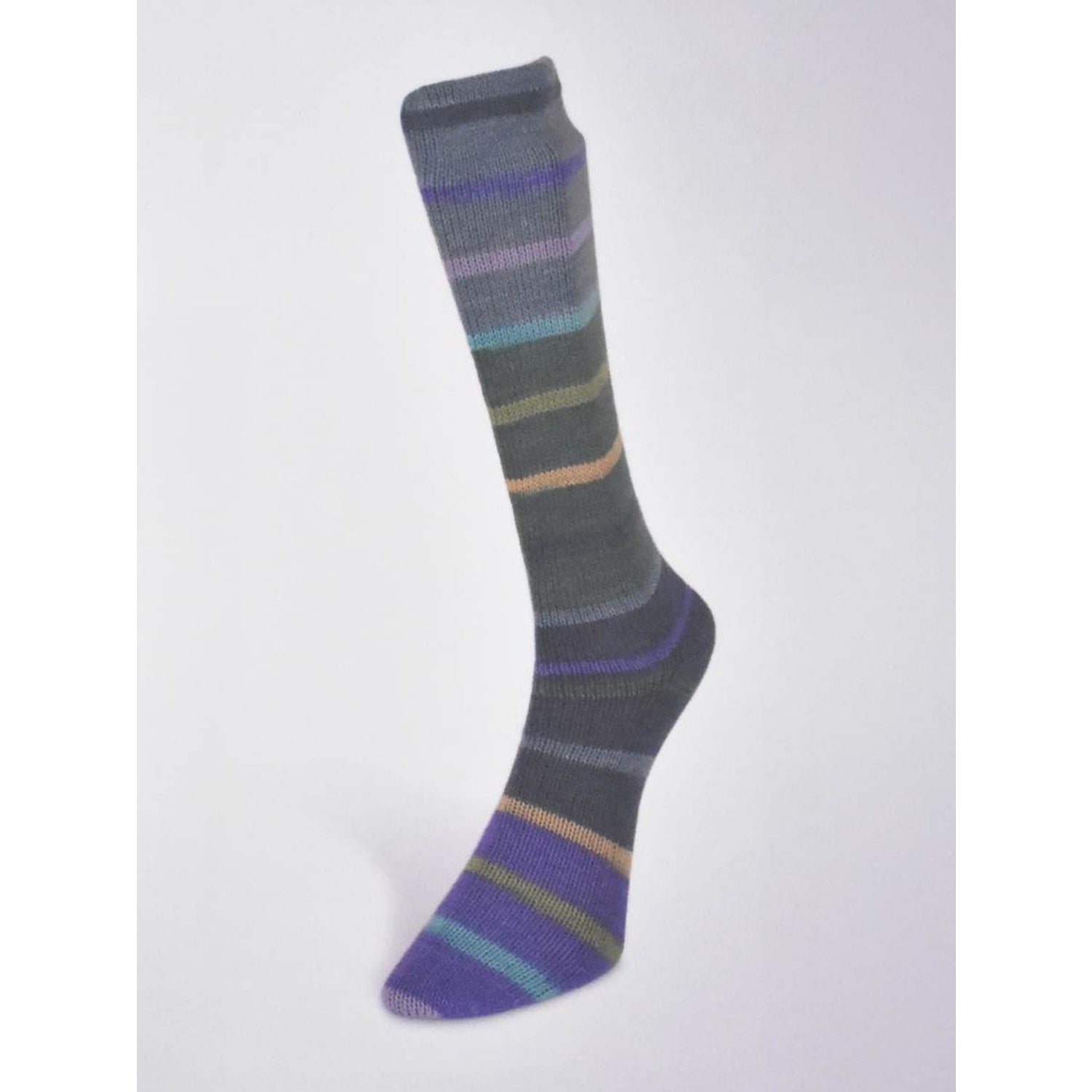 Hand-knit sock made from Laines du Nord Indulgence sock yarn in shades of gray and colorful stripes
