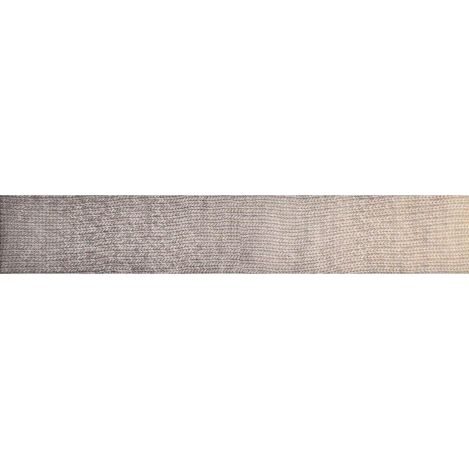 Close-up of Knitting Fever Laines du Nord luxury yarn in neutral beige tones showing fine texture