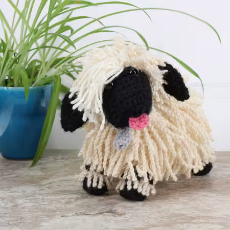 Leisure Arts amigurumi kit lamb with fluffy cream yarn and black accents for crafting enthusiasts
