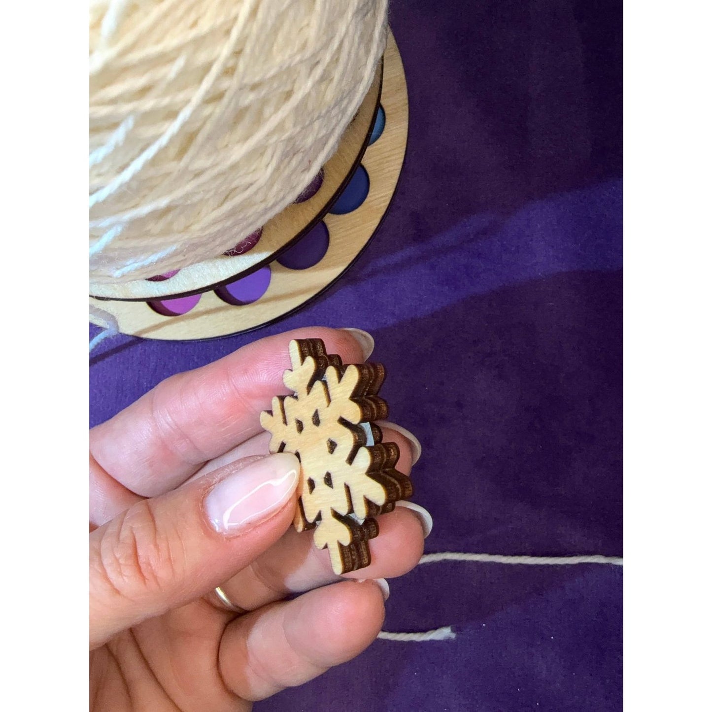 Handcrafted wooden snowflake ornament by Lemonwood Elementary with natural wood finish