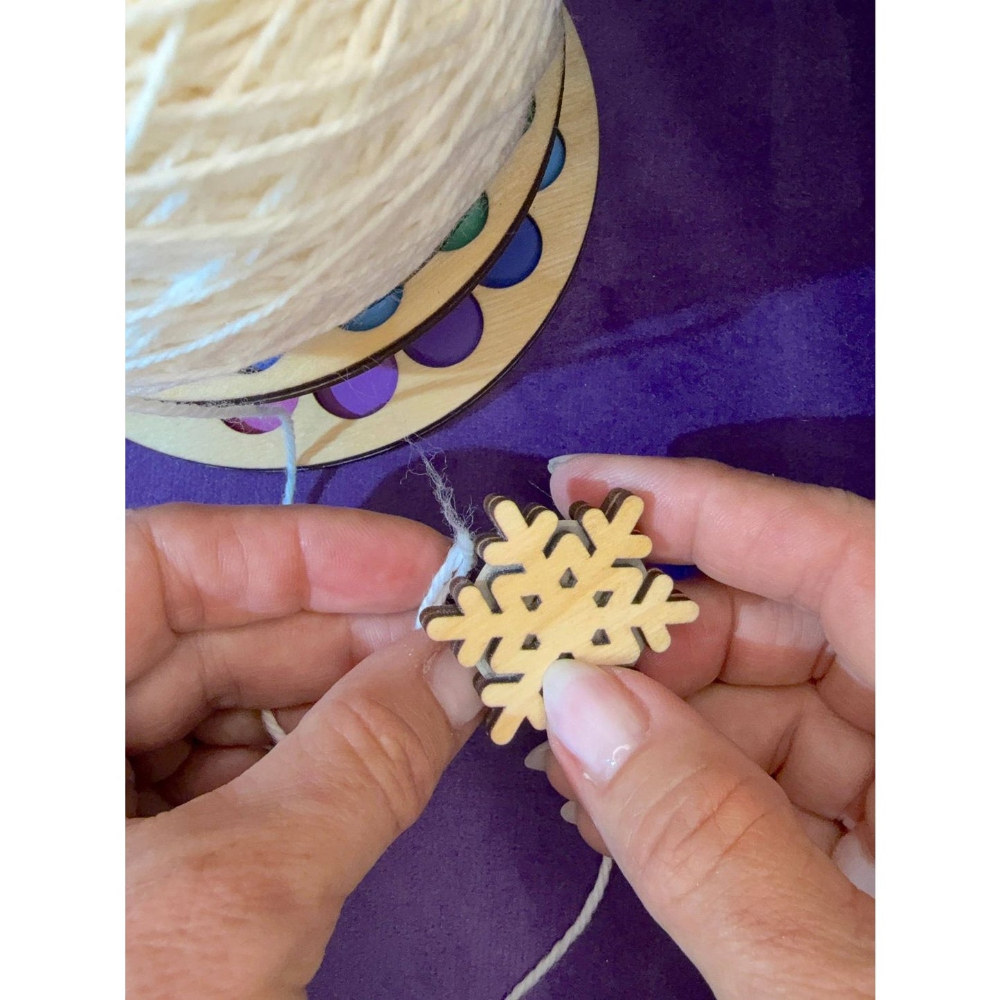 Crafting with Lemonwood elementary wooden snowflake ornament and yarn for holiday decoration