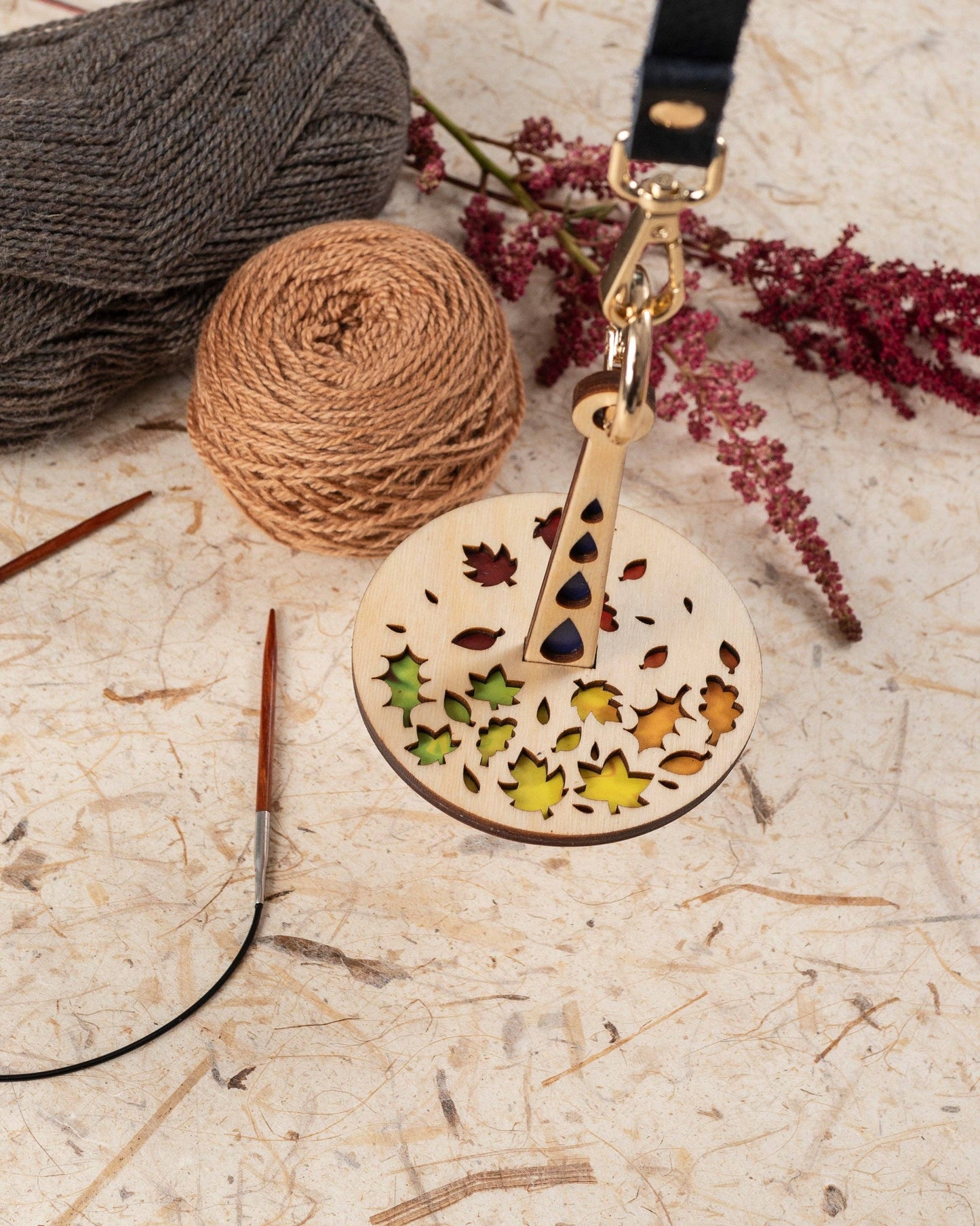 Lemonwood Autumn Tour stitch marker wooden round leaf design knitting marker on leather strap with gold clasp and yarn balls