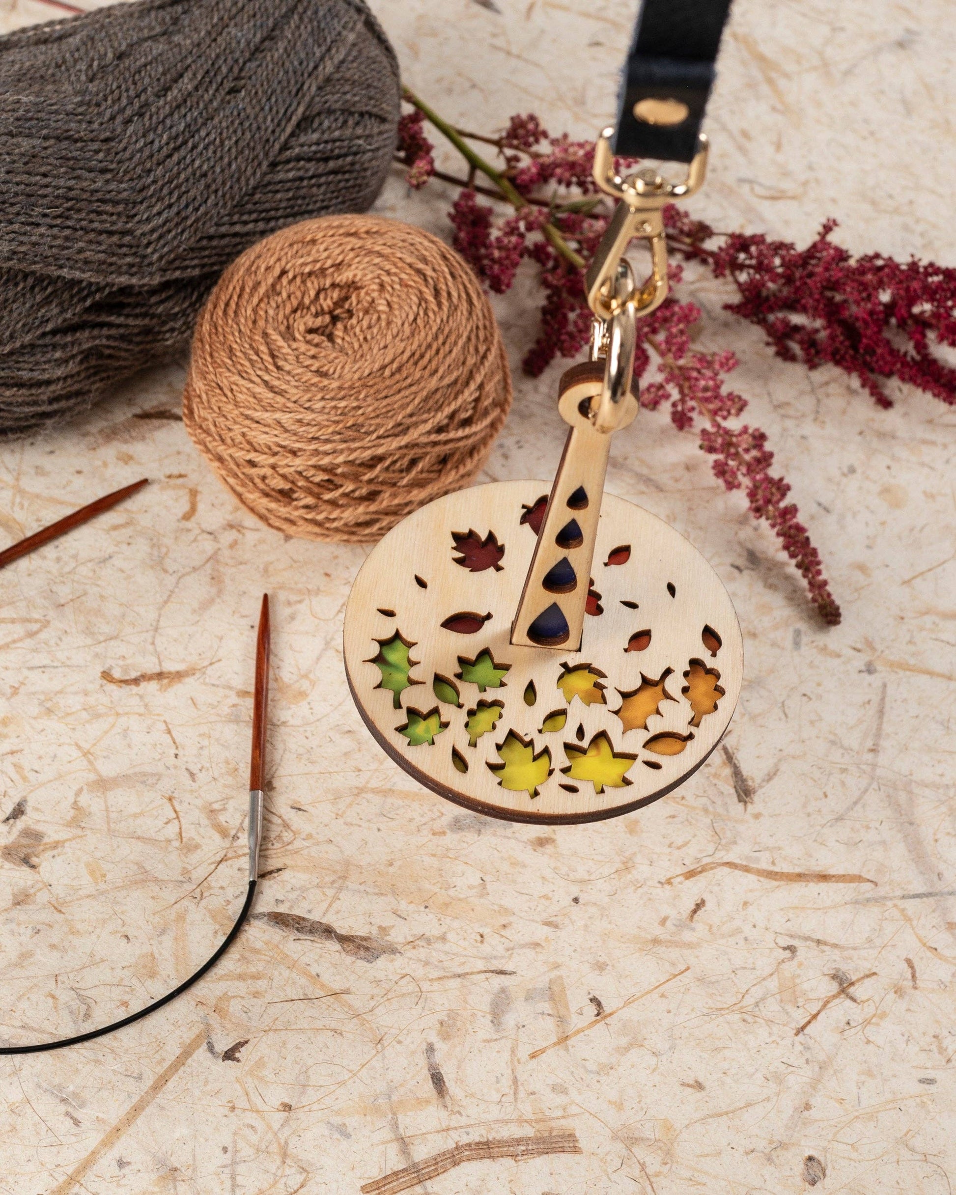 Lemonwood Autumn Tour stitch marker wooden round leaf design knitting marker on leather strap with gold clasp and yarn balls