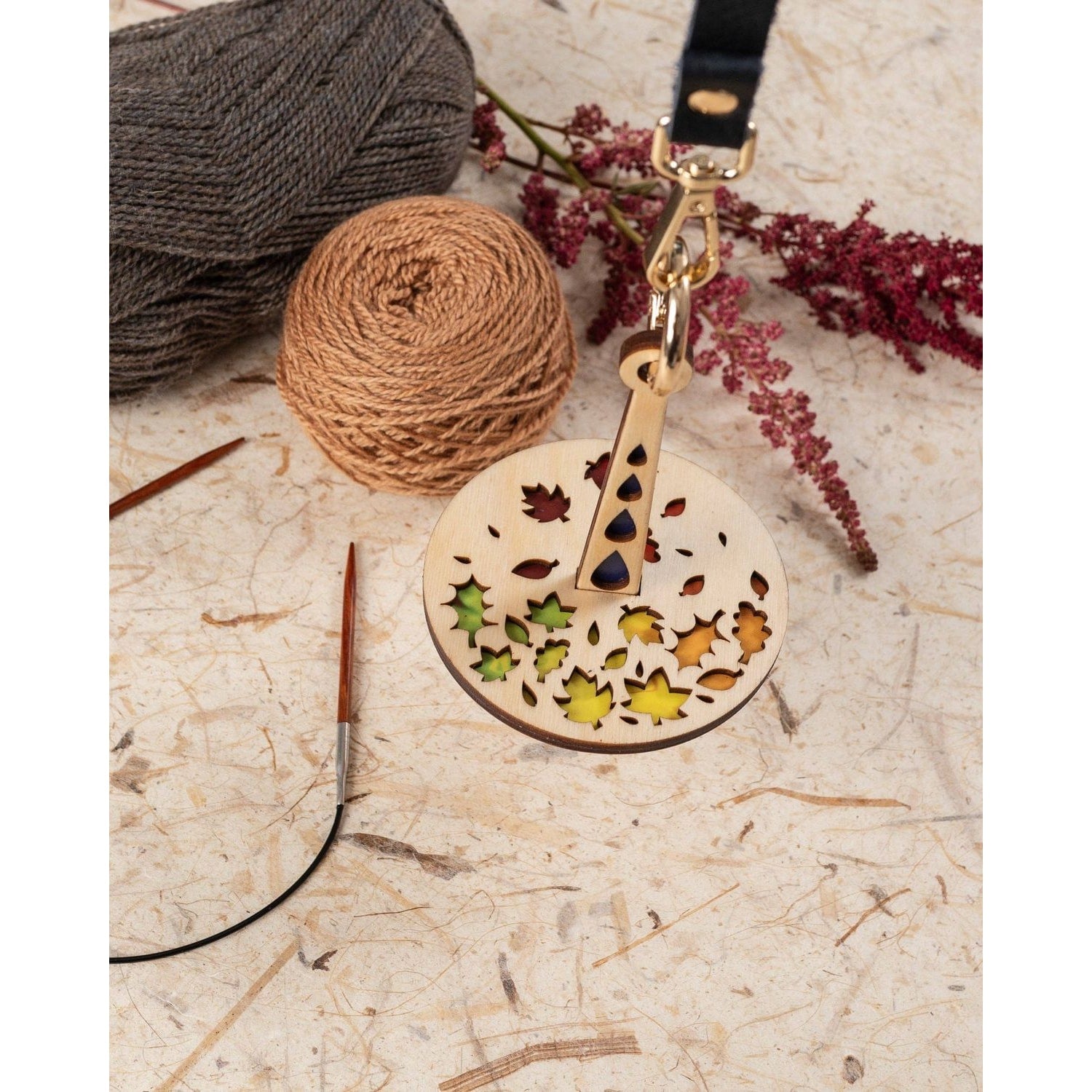 Lemonwood Autumn Tour stitch marker wooden round leaf design knitting marker on leather strap with gold clasp and yarn balls