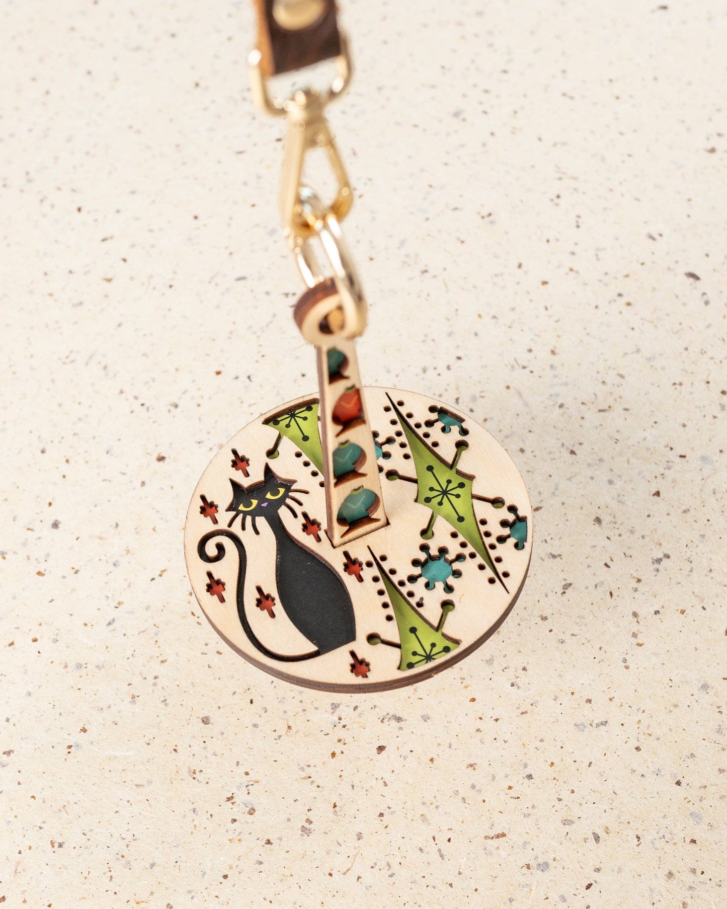 lemonwood kitty kitty yarn accessory round wooden cat keychain with black cat silhouette and retro floral inlay