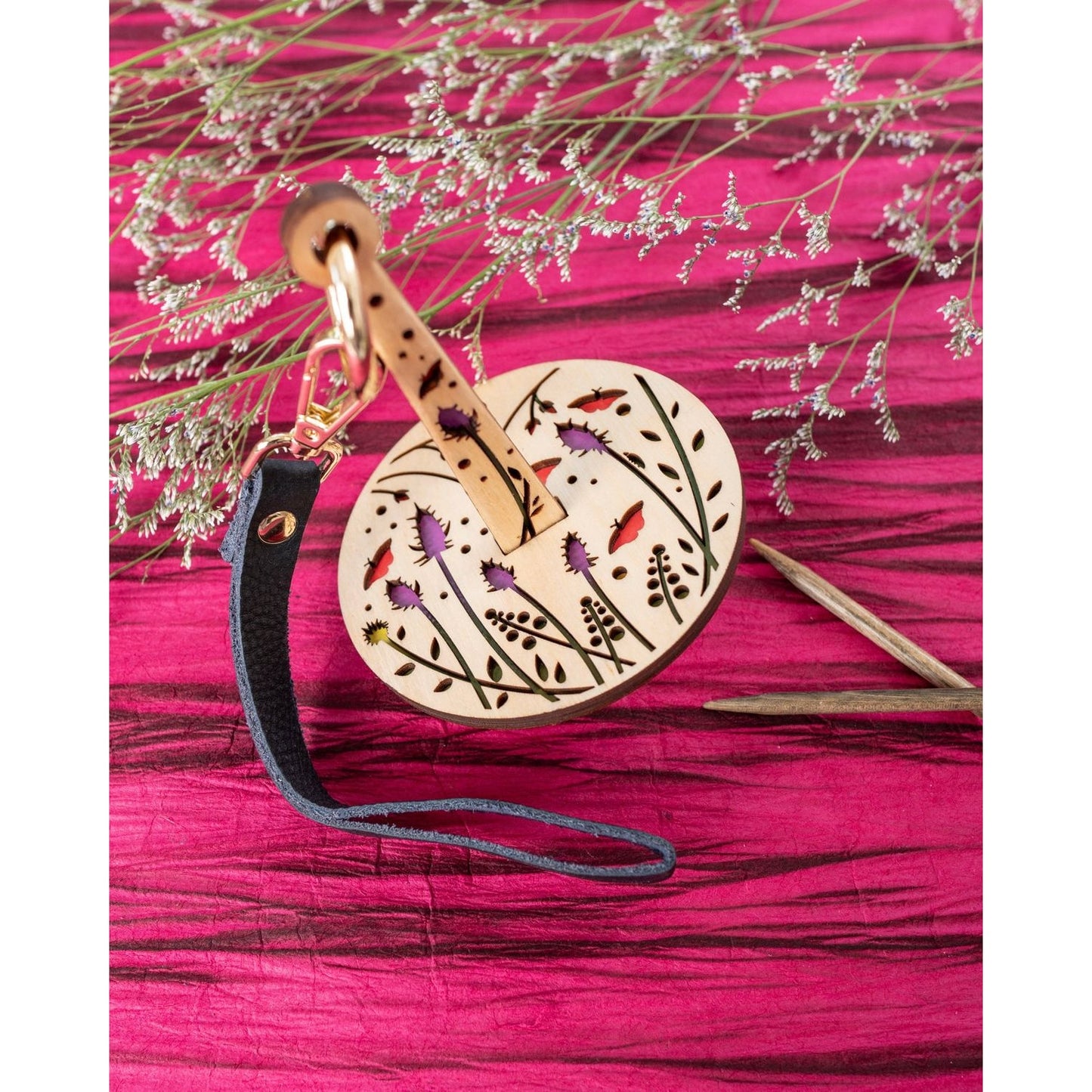 lemonwood knitting accessory wooden drop spindle with floral cutouts painted birds and leather strap