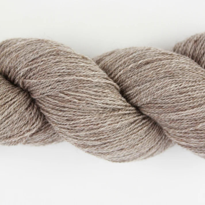 Soft beige lotus yarns skein, perfect for knitting and crocheting projects