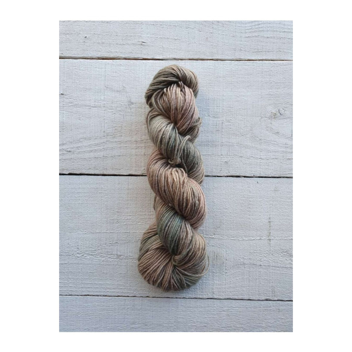 Manos del Uruguay Fino yarn in earthy tones, perfect for delicate knitting projects