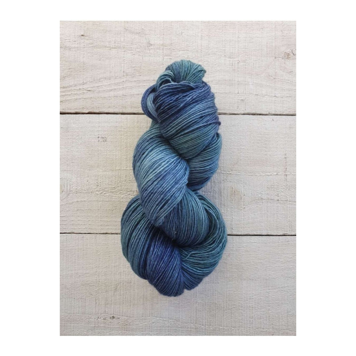 Manos del Uruguay Fino yarn in shades of blue, perfect for knitting and crochet projects