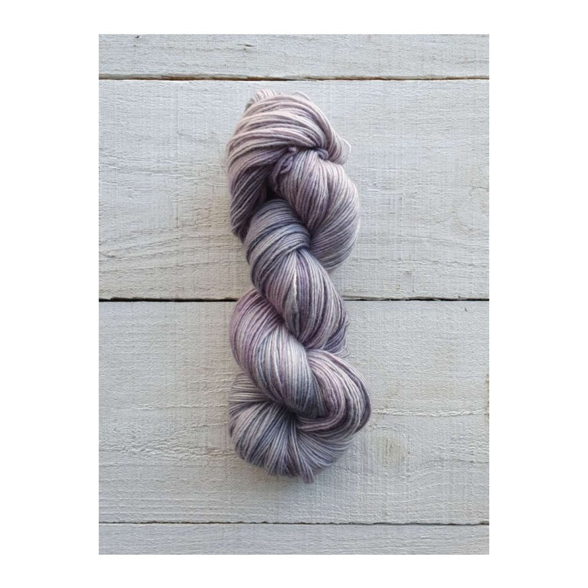 Manos del Uruguay Fino yarn in soft lavender tones, perfect for knitting and crochet projects