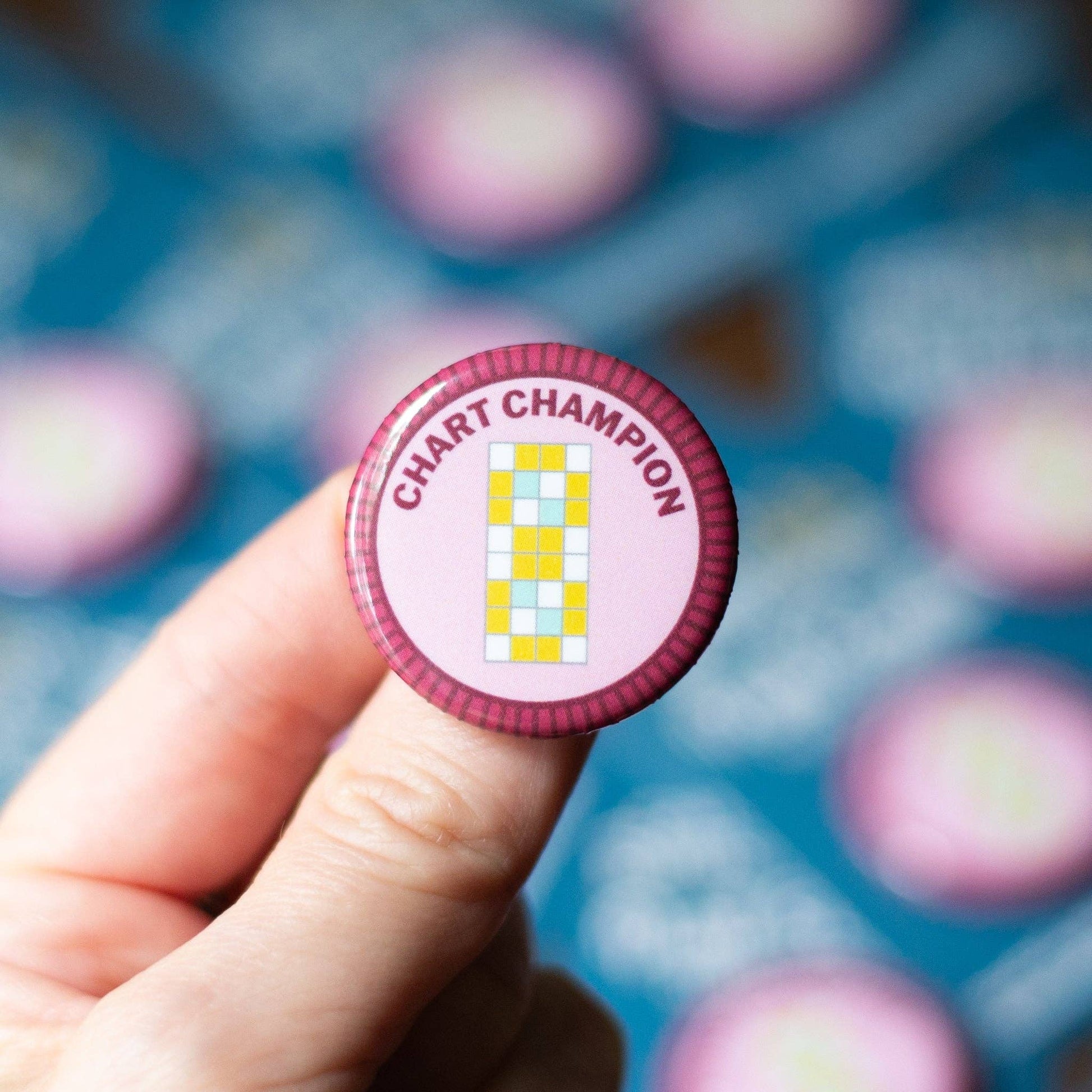 Camp Stitchwood Chart Champion Button promoting merit badge required for eagle scouts