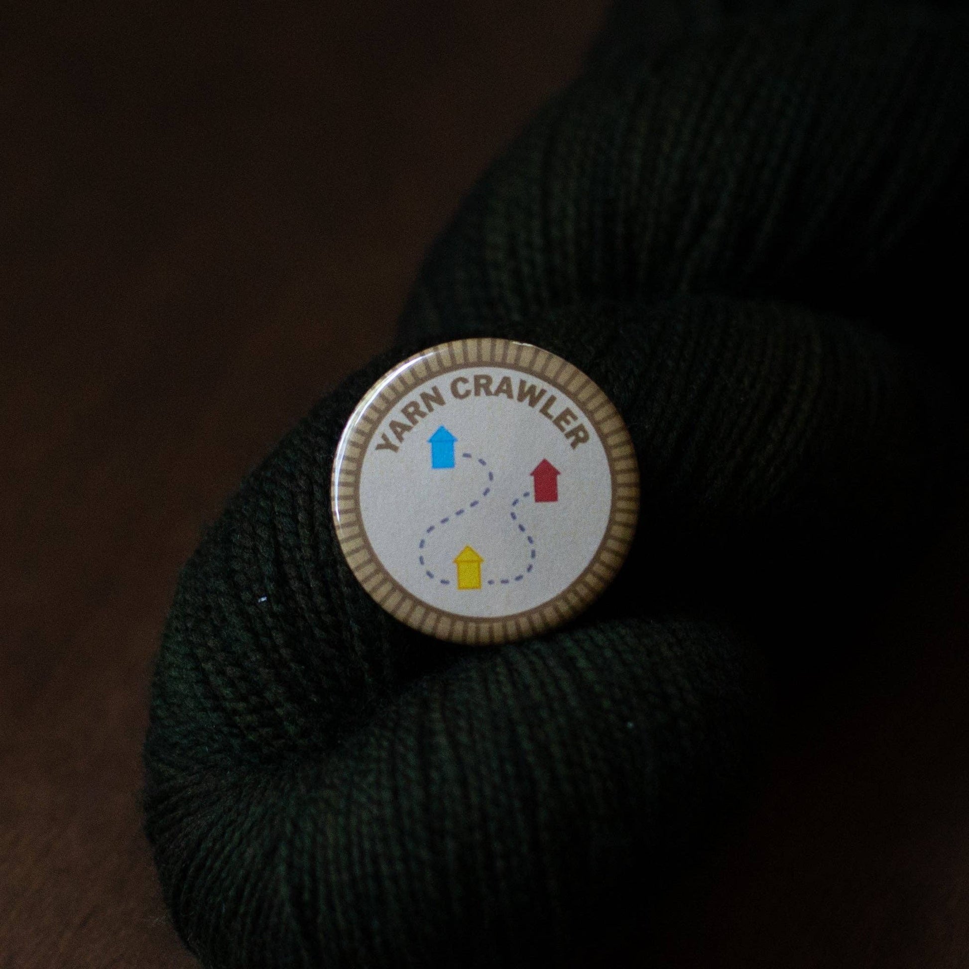 Yarn Crawler Button on Dark Green Yarn from Camp Stitchwood for michaels crafts yarn projects