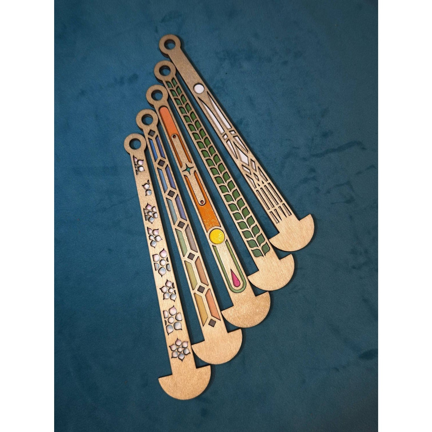 Set of colorful wooden mini stick hockey sticks in various designs for fun indoor play
