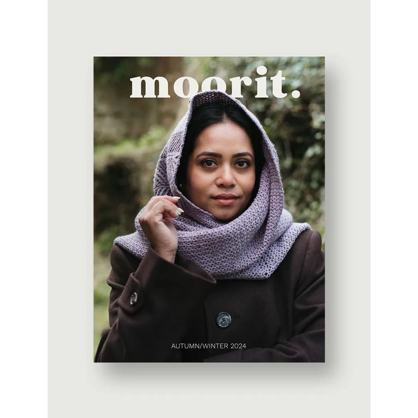 Moorit Magazine crochet patterns cover featuring woman wearing lavender crochet hooded scarf outdoors