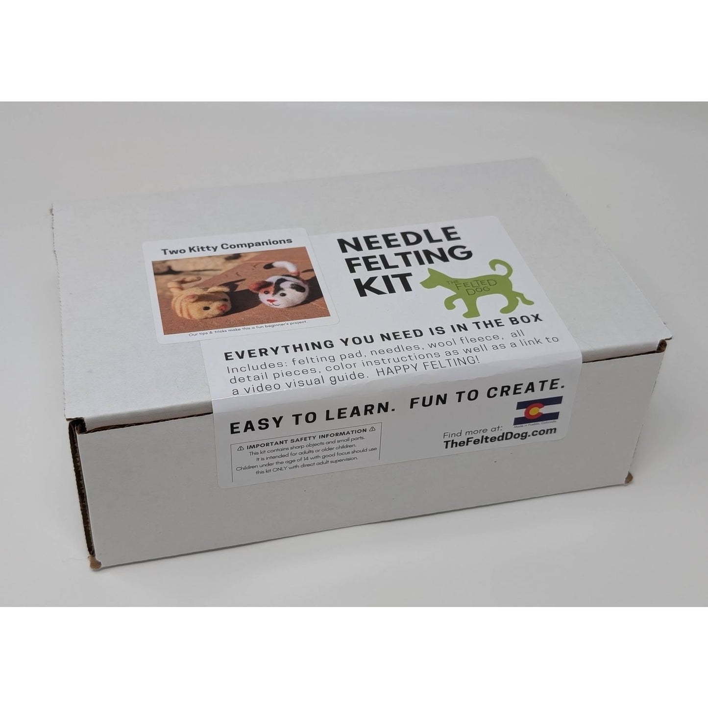 The Felted Dog Needle Felting Needles Kit Box with materials for creating furry companions