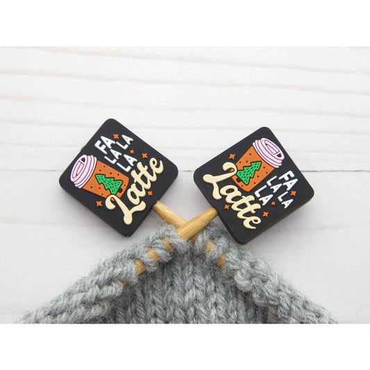 Fa La La La Latte stitch stopper set. Black square stitch stoppers with latte cup design on knitting needles