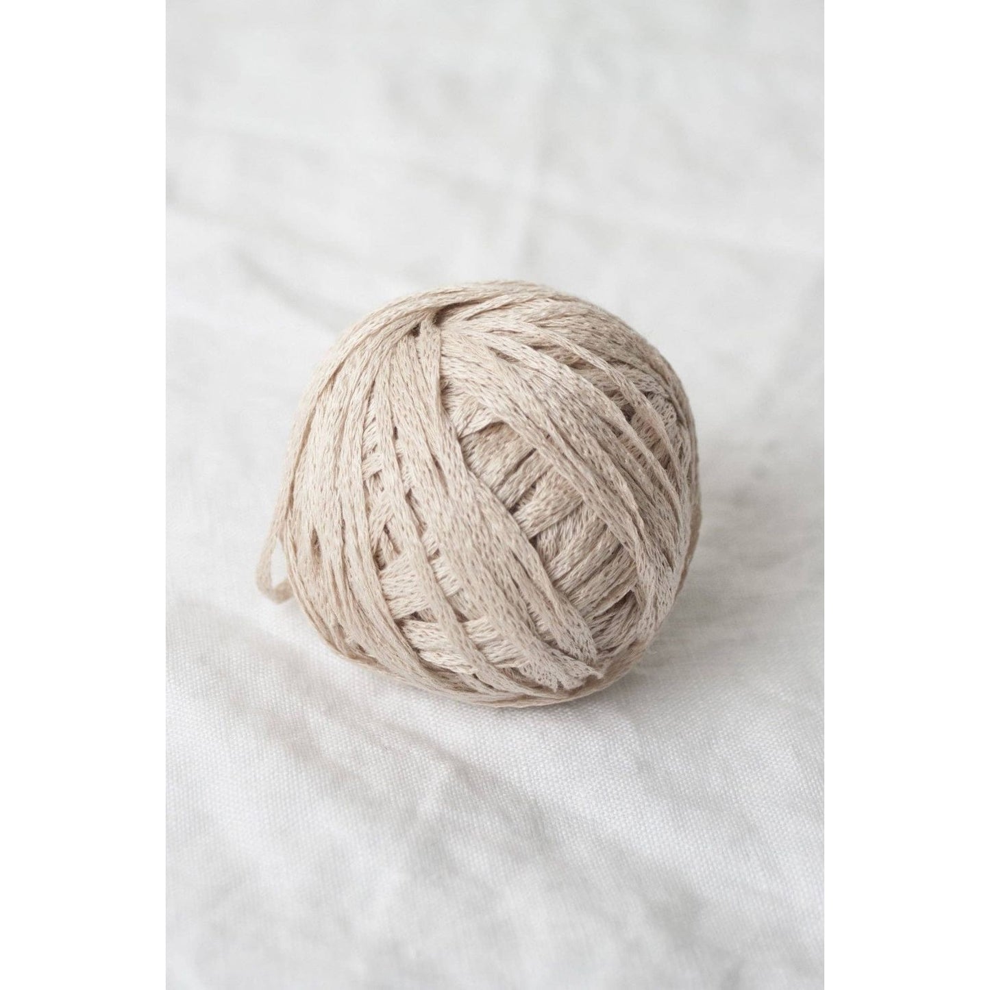 Quince & Co. organic Italian yarn in soft beige, perfect for knitting and crafting projects