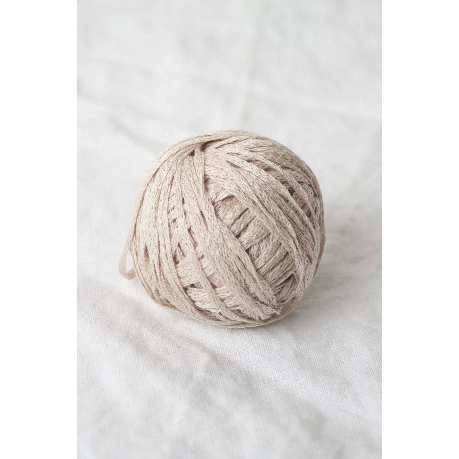 Quince & Co. organic Italian yarn in soft beige, perfect for knitting and crafting projects