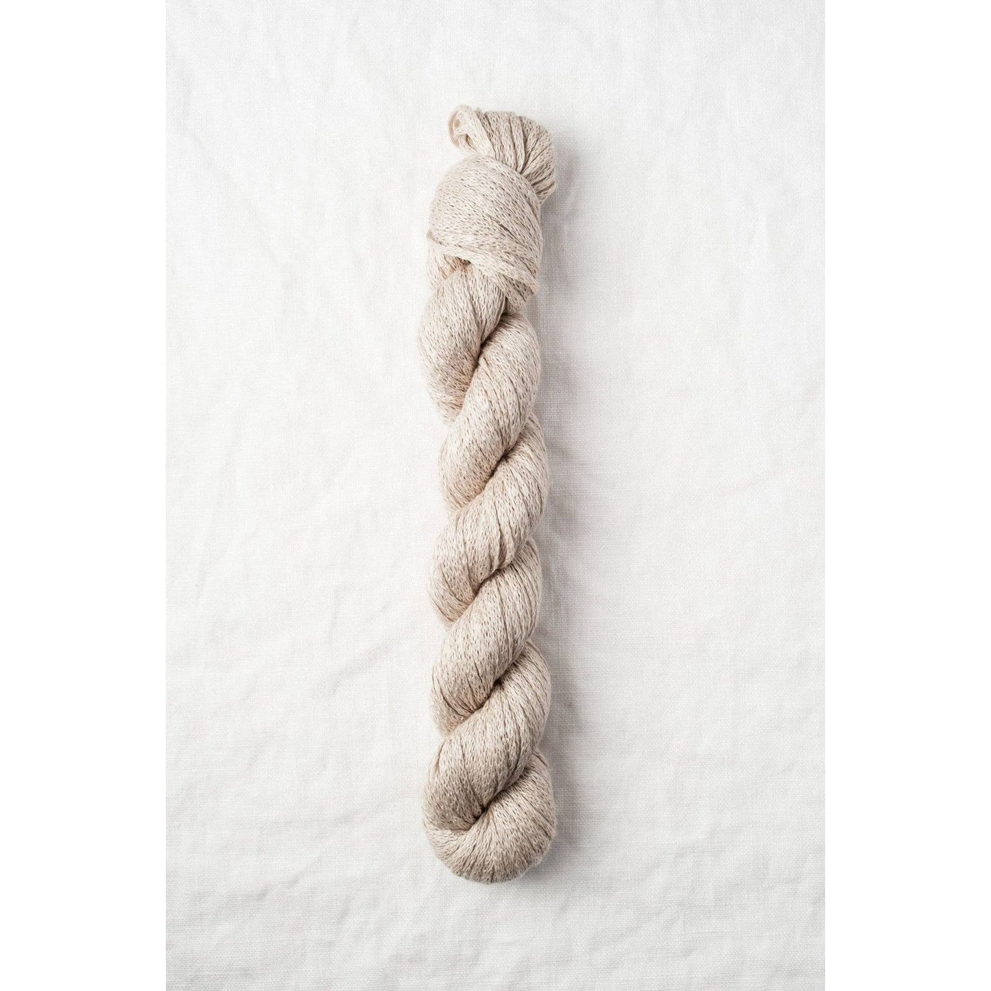 Quince & Co. organic Italian yarn in a natural beige color, perfect for knitting and crafting projects