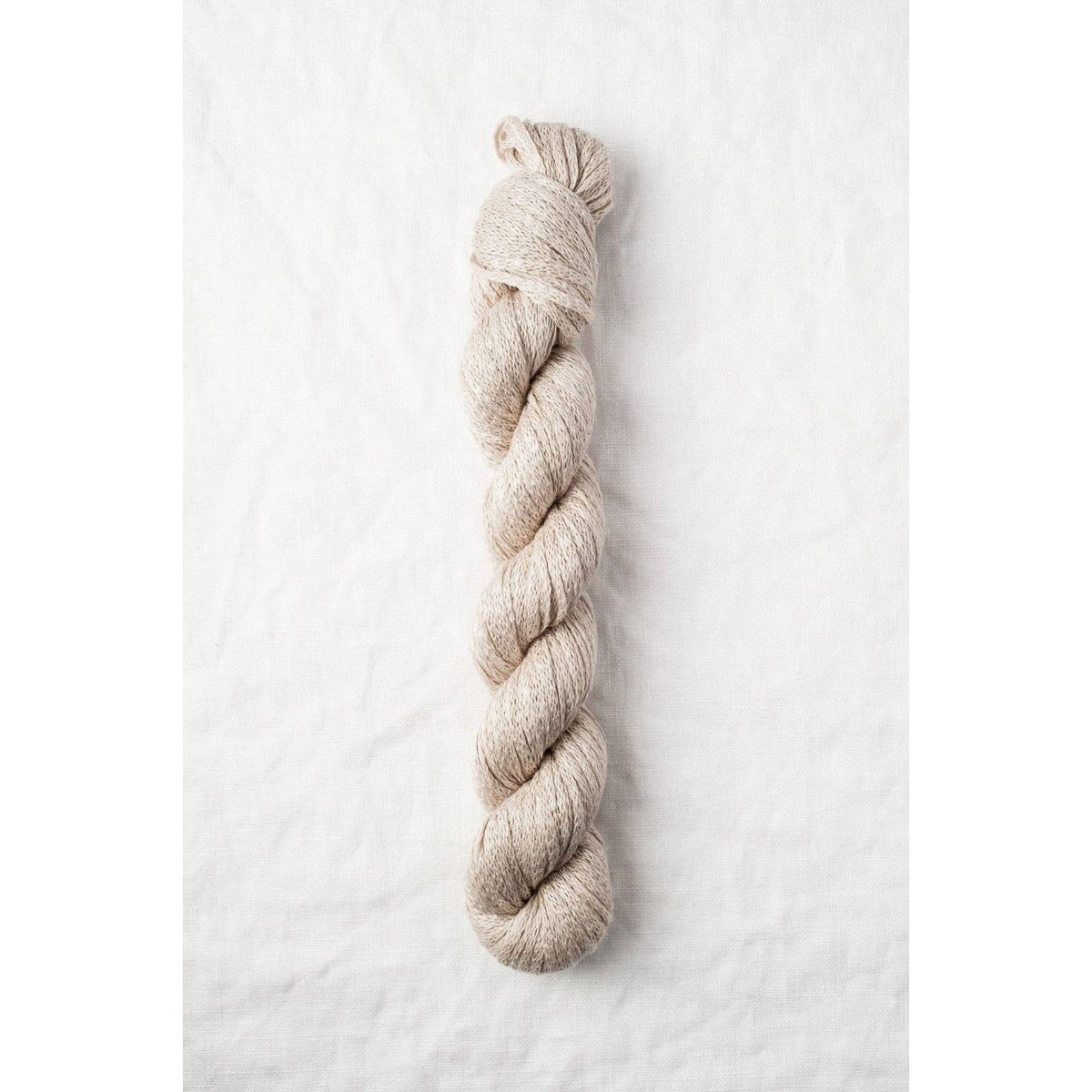 Quince & Co. organic Italian yarn in a natural beige color, perfect for knitting and crafting projects
