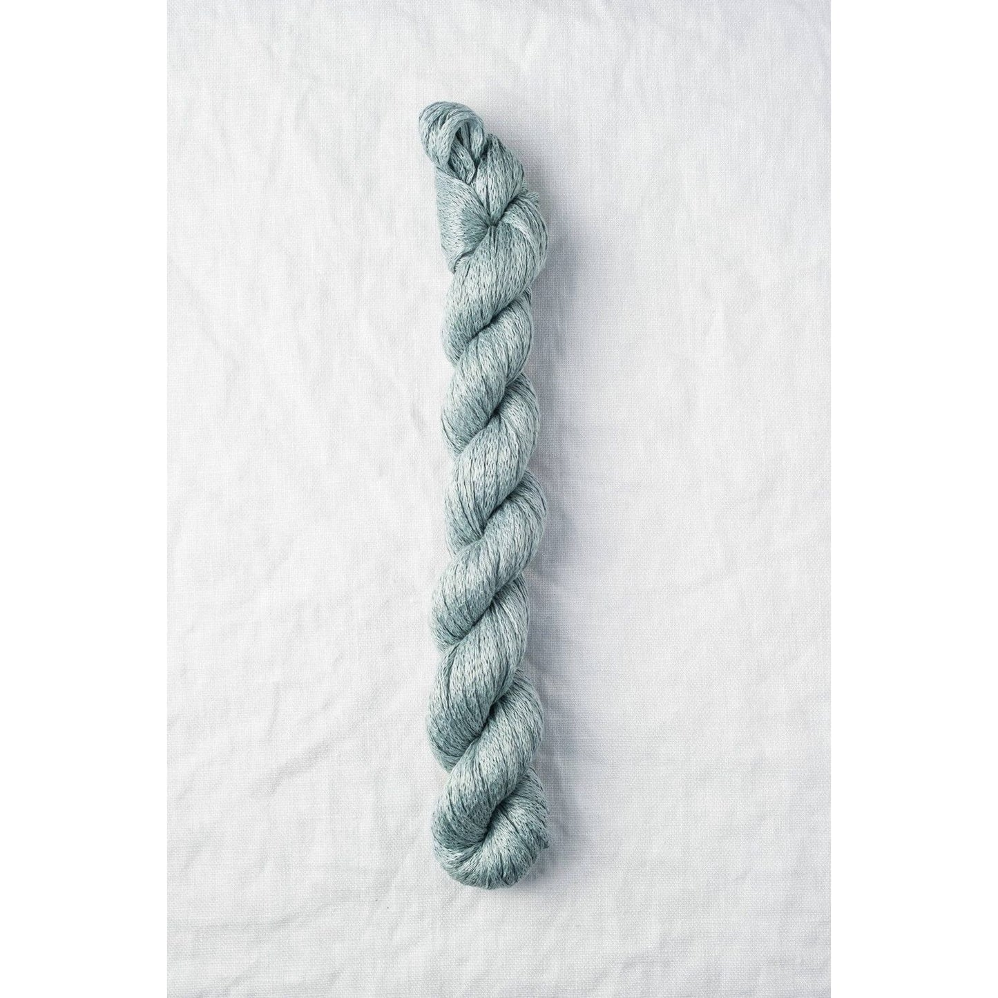 Quince & Co. Organic Italian yarn in soft blue color for knitting and crocheting projects