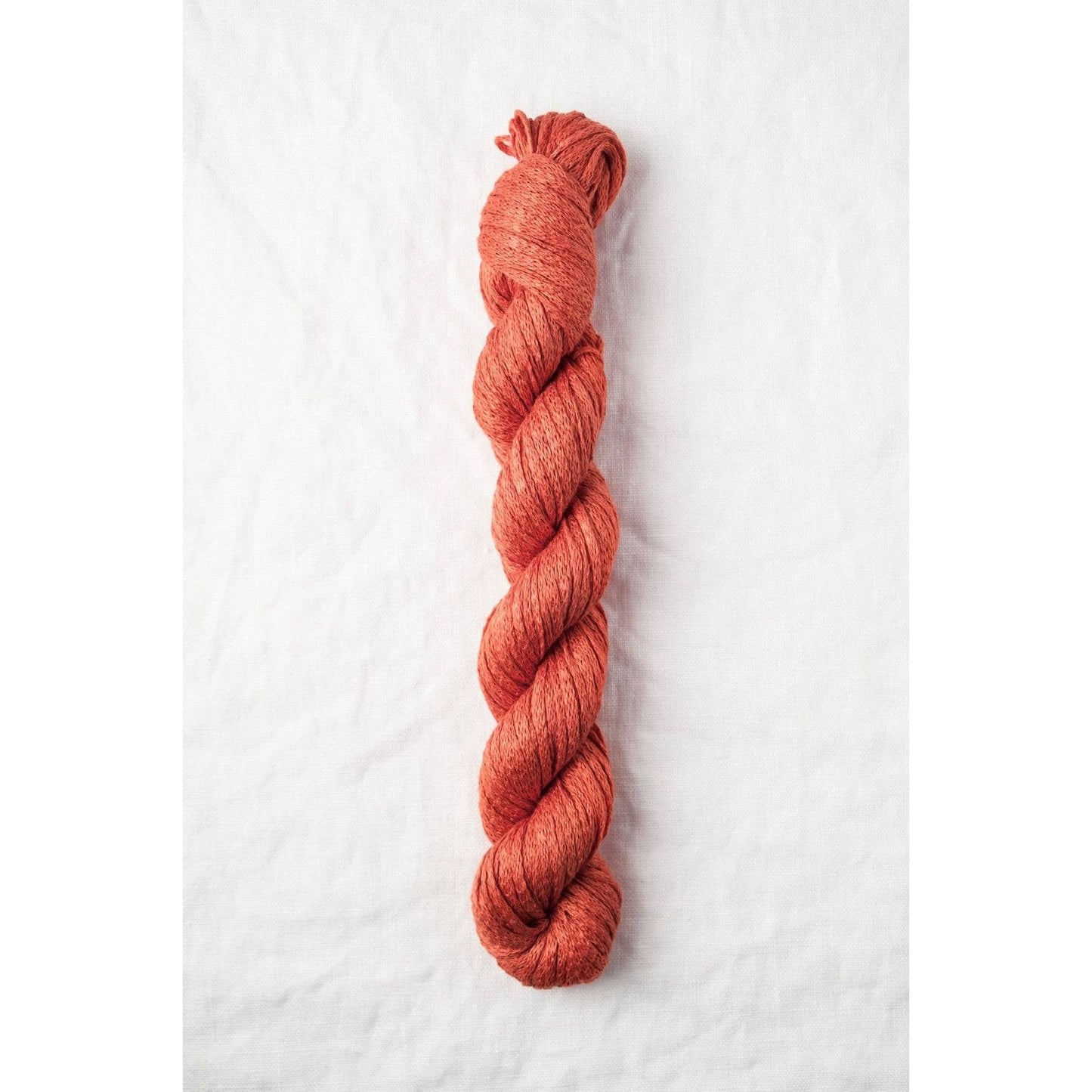 Quince & Co. Organic Italian yarn in a rich terracotta shade perfect for sustainable knitting projects