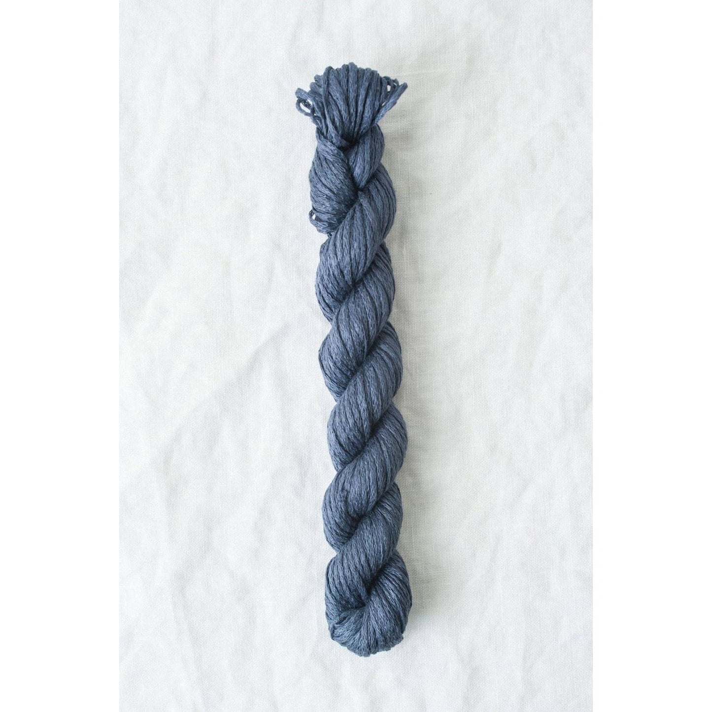 Quince & Co. Organic Italian yarn in deep blue, perfect for eco-friendly knitting projects