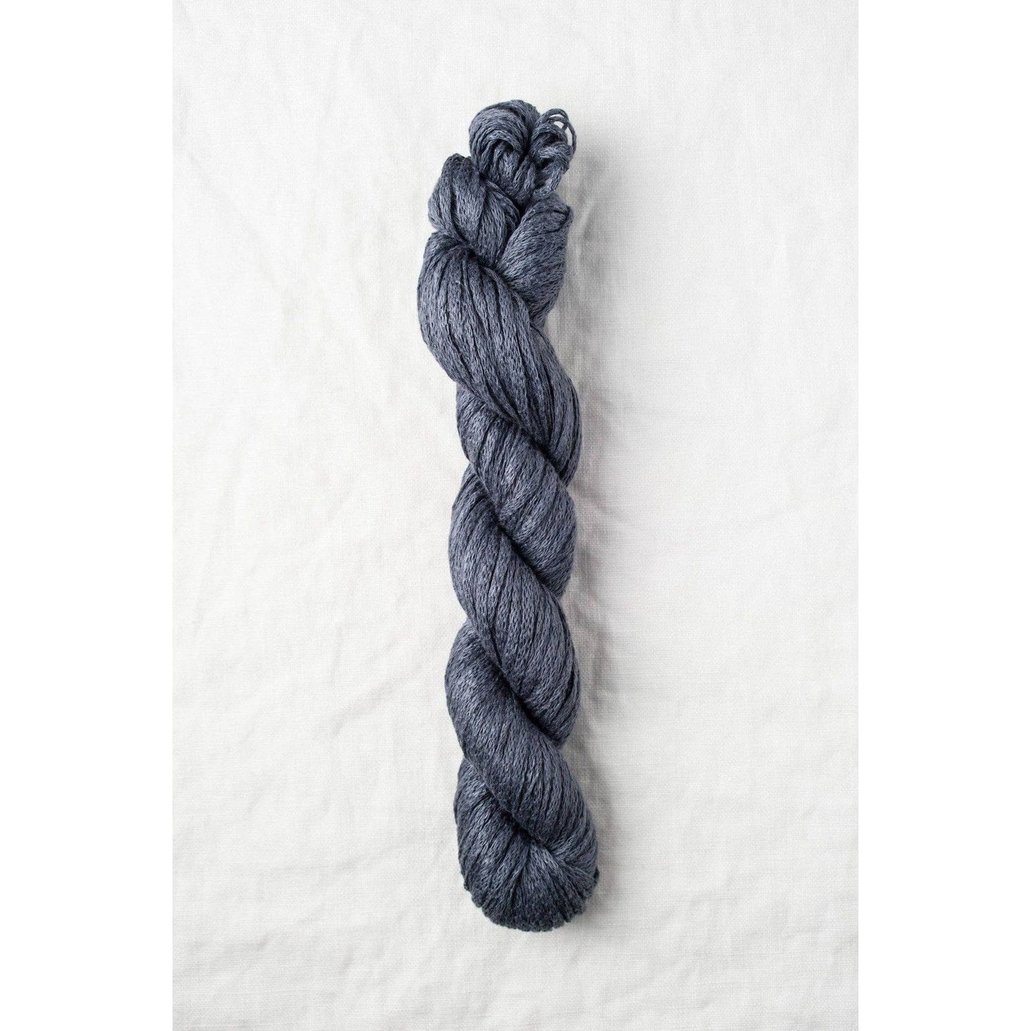 Quince & Co. Organic Italian yarn in a rich navy color, perfect for knitting and crocheting projects