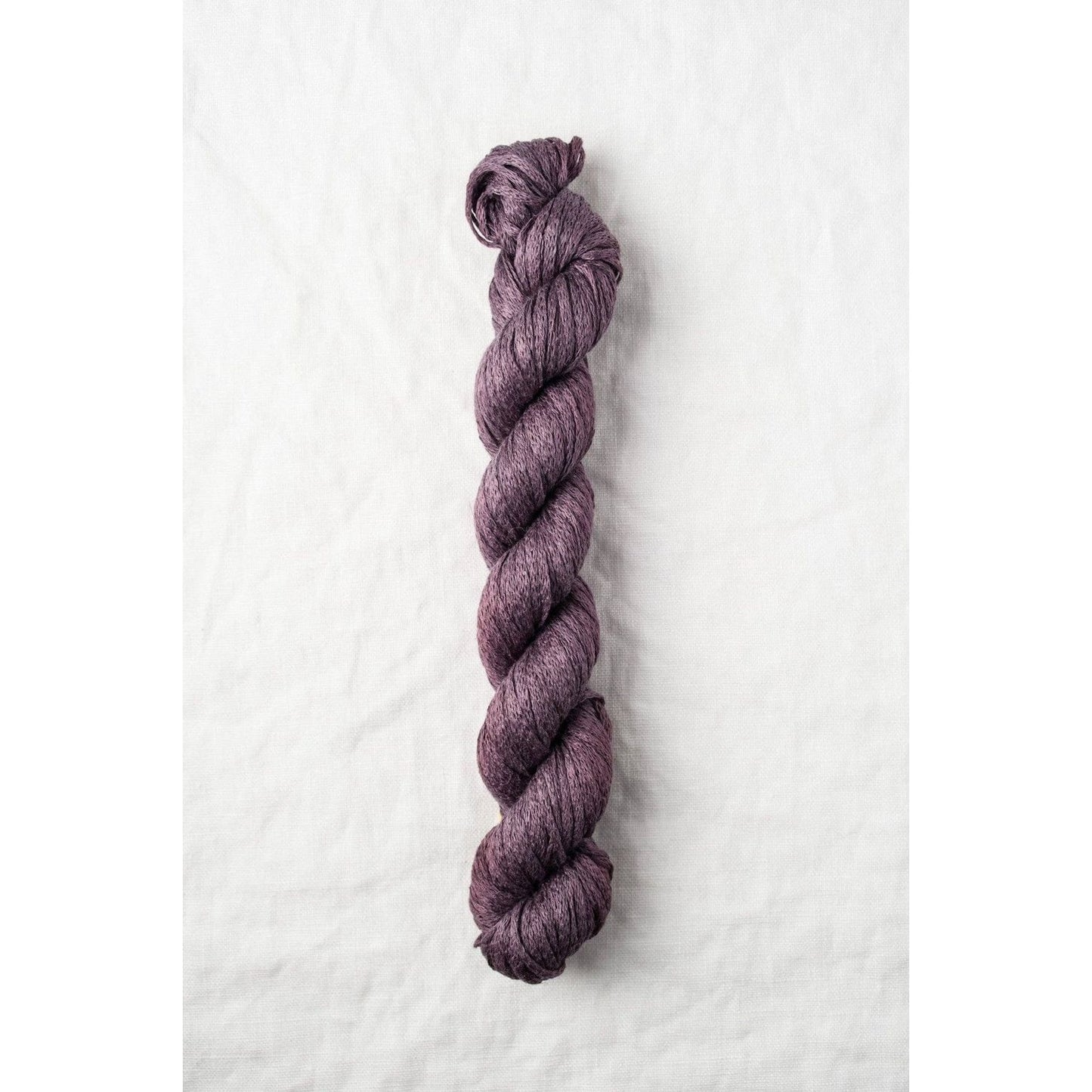 Quince & Co. organic Italian yarn in a rich plum color, perfect for knitting and crochet projects