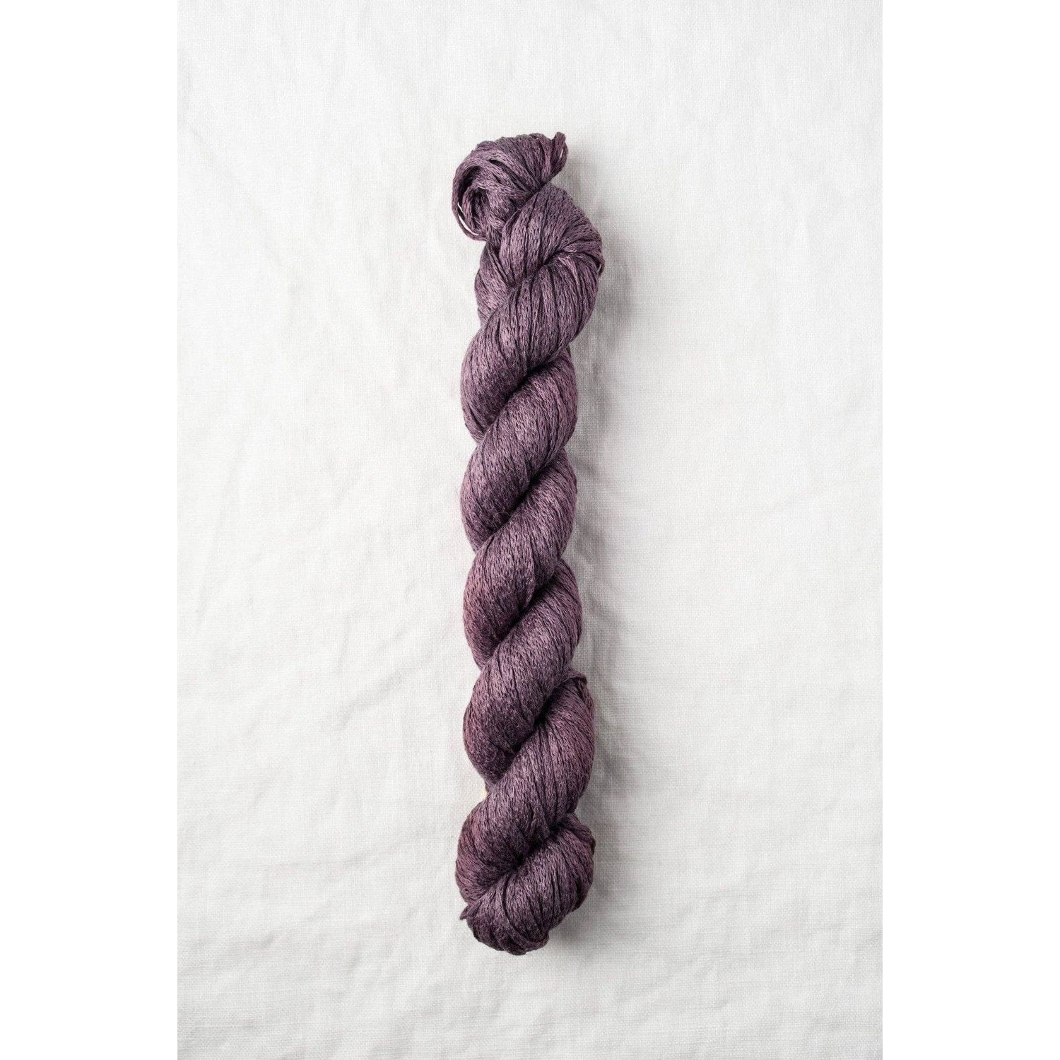 Quince & Co. organic Italian yarn in a rich plum color, perfect for knitting and crochet projects
