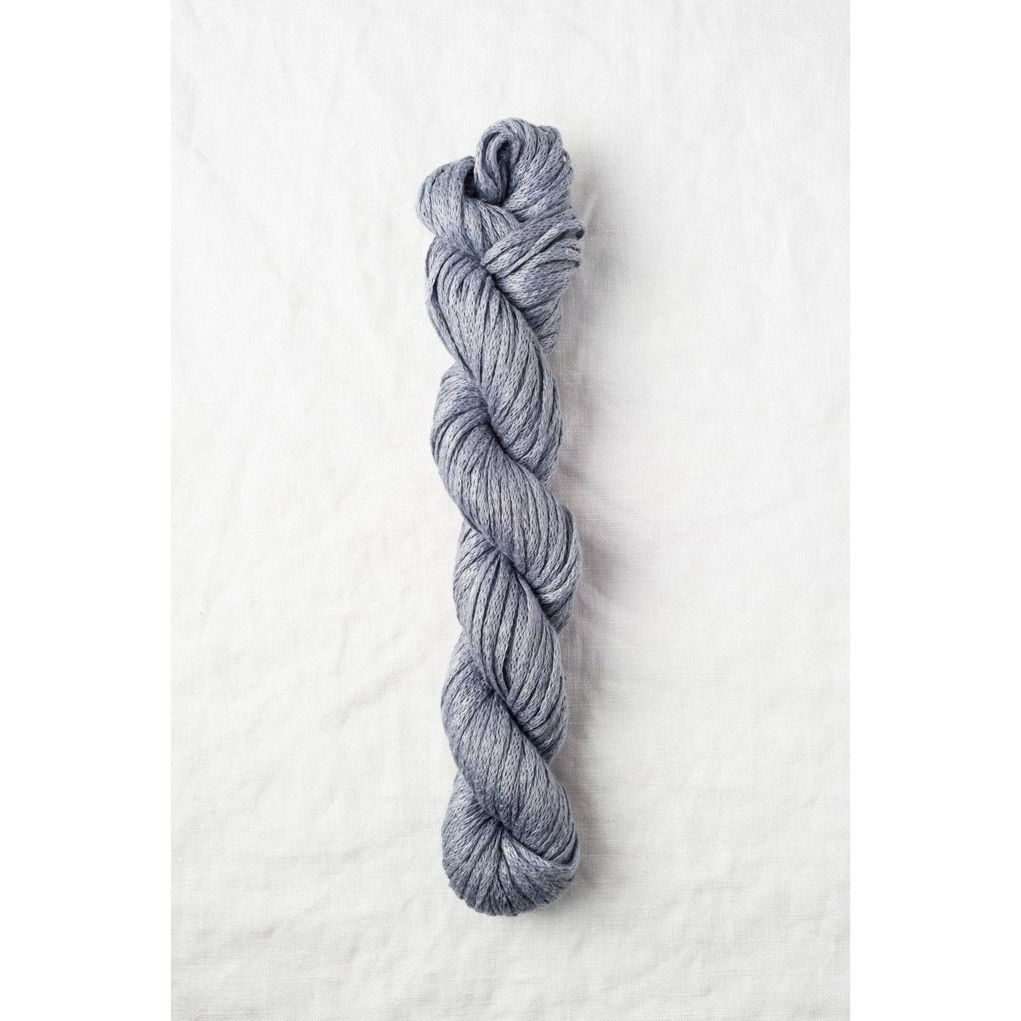 Quince & Co. organic Italian yarn in a soft gray color, perfect for knitting and crafting projects