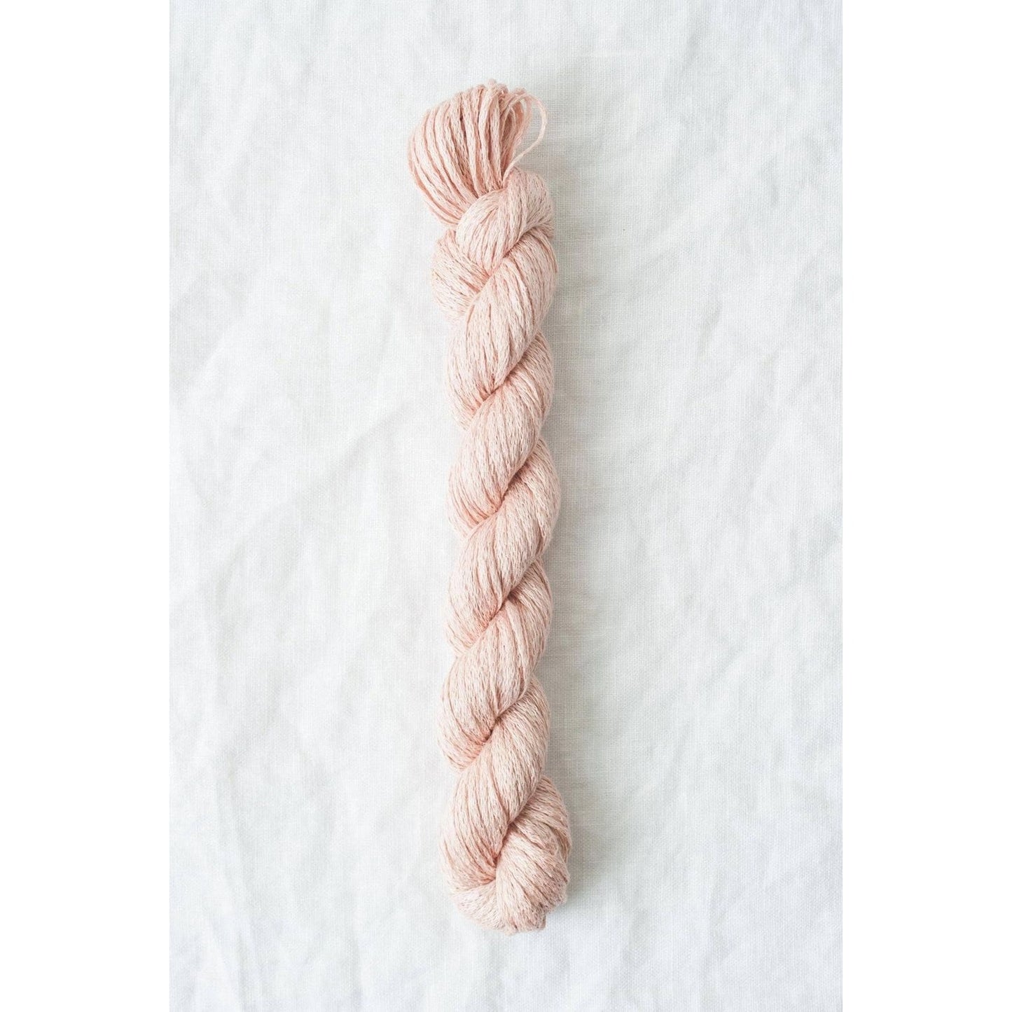 Quince & Co. organic Italian yarn in light pink, perfect for knitting and crafting projects