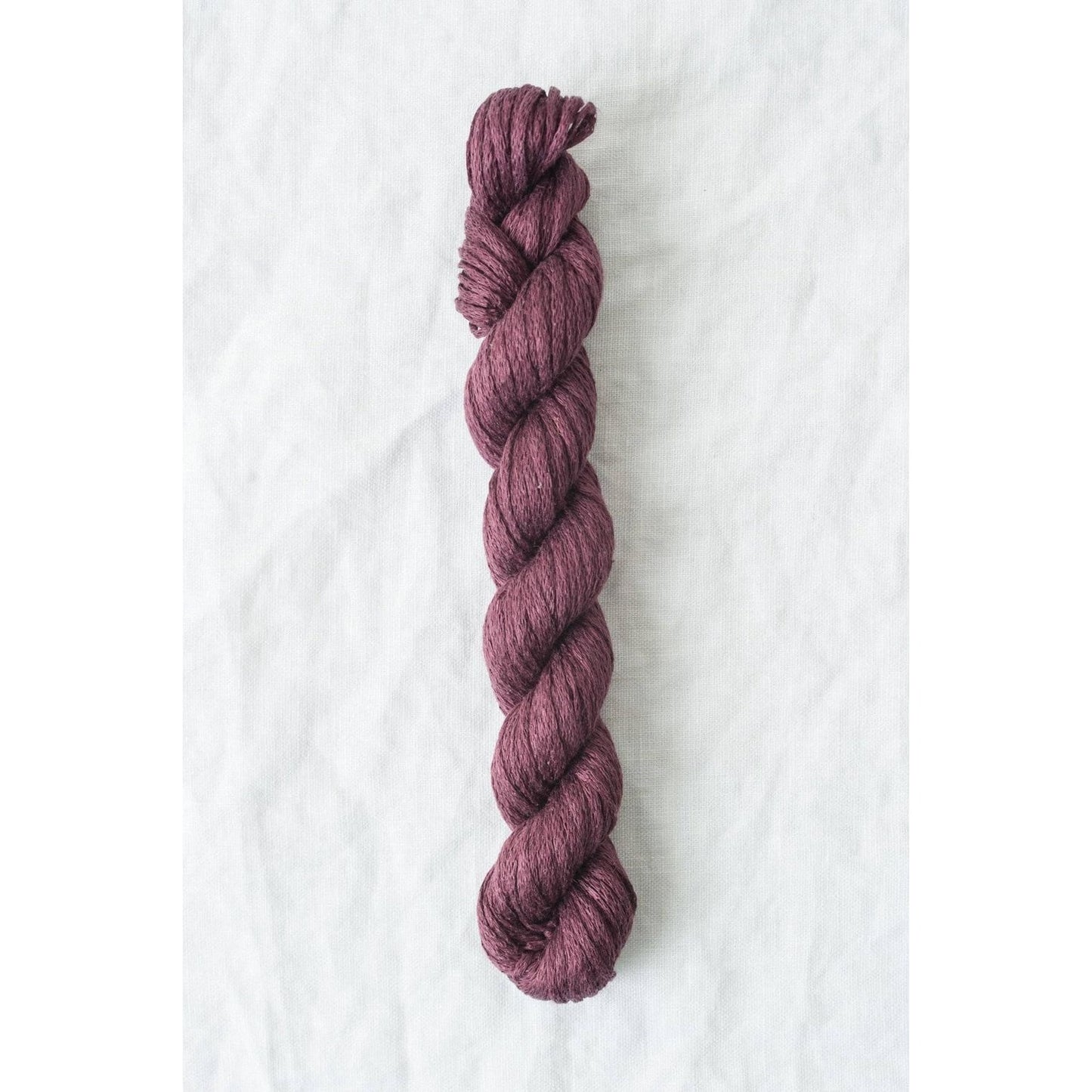 Quince & Co. Organic Italian yarn in deep purple twist for knitting and crafting projects