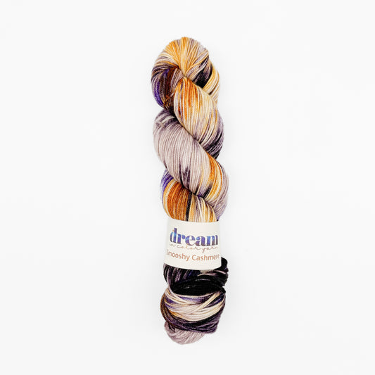 Madelinetosh Plumwood hand-dyed cashmere yarn with a beautiful blend of purple, orange, and natural tones