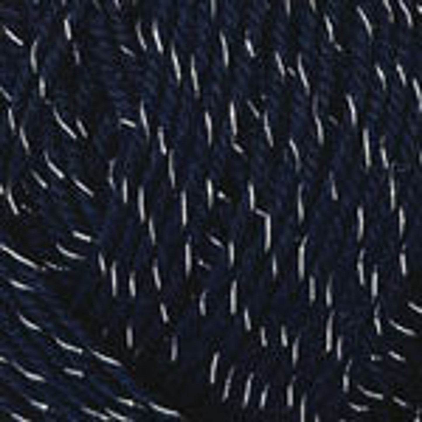 Close-up of navy blue Plymouth Galway Wool Worsted Yarn with white flecks for knitting and crocheting projects